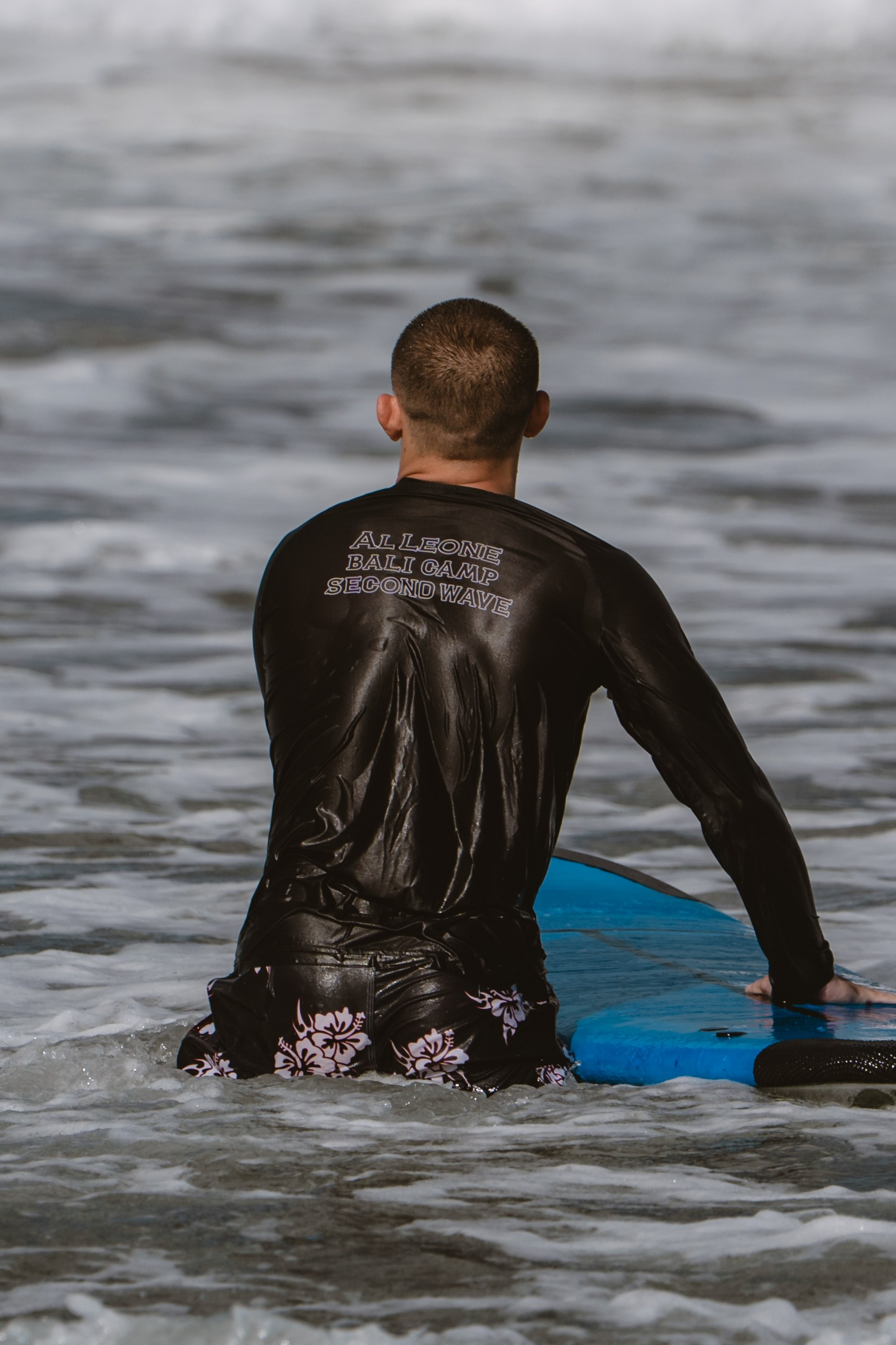 Mixed martial artists having fun surfing at the ocean in between training sessions. Сергей Зворыгин