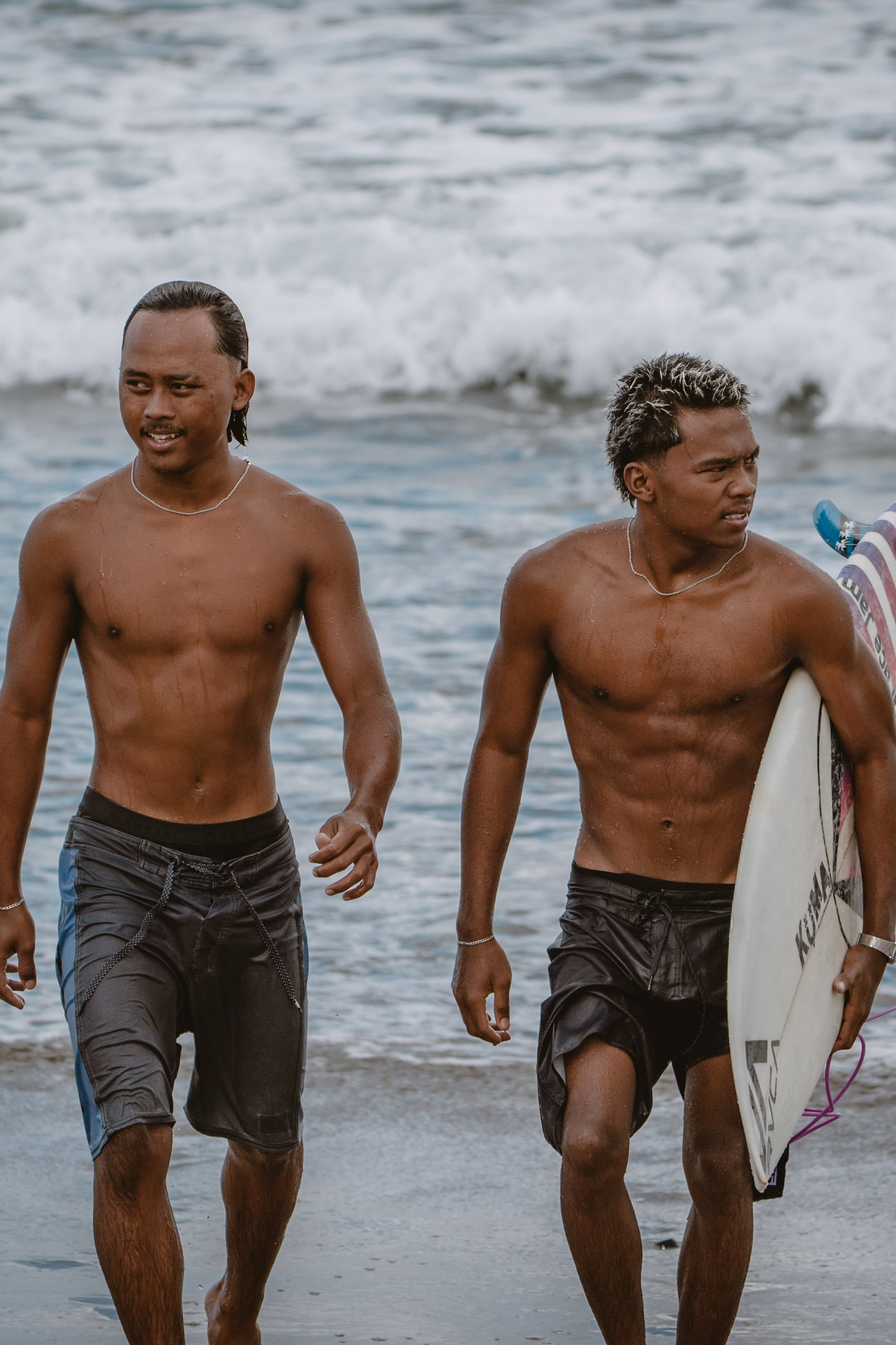 Mixed martial artists having fun surfing at the ocean in between training sessions. Сергей Зворыгин