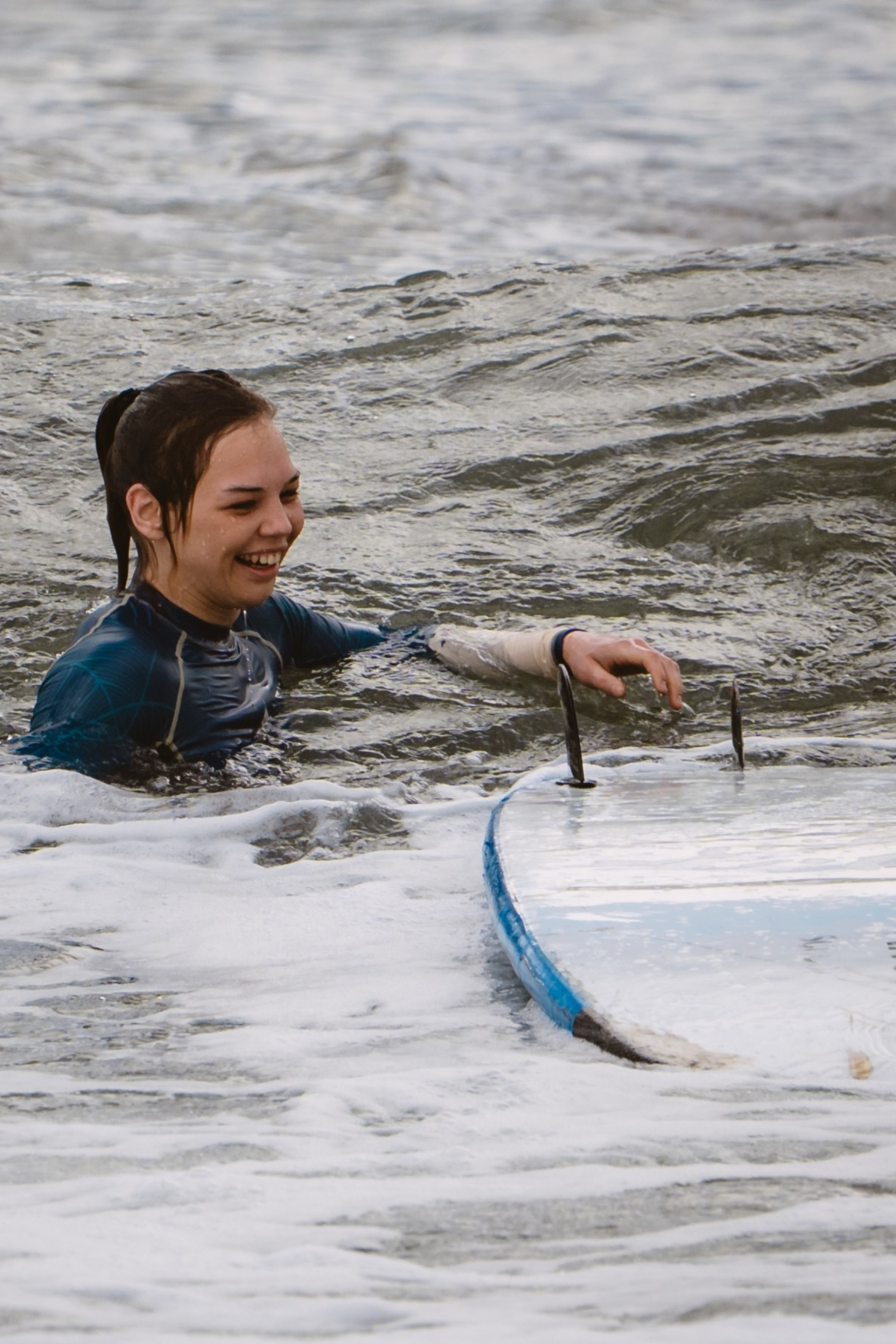 Mixed martial artists having fun surfing at the ocean in between training sessions. Сергей Зворыгин