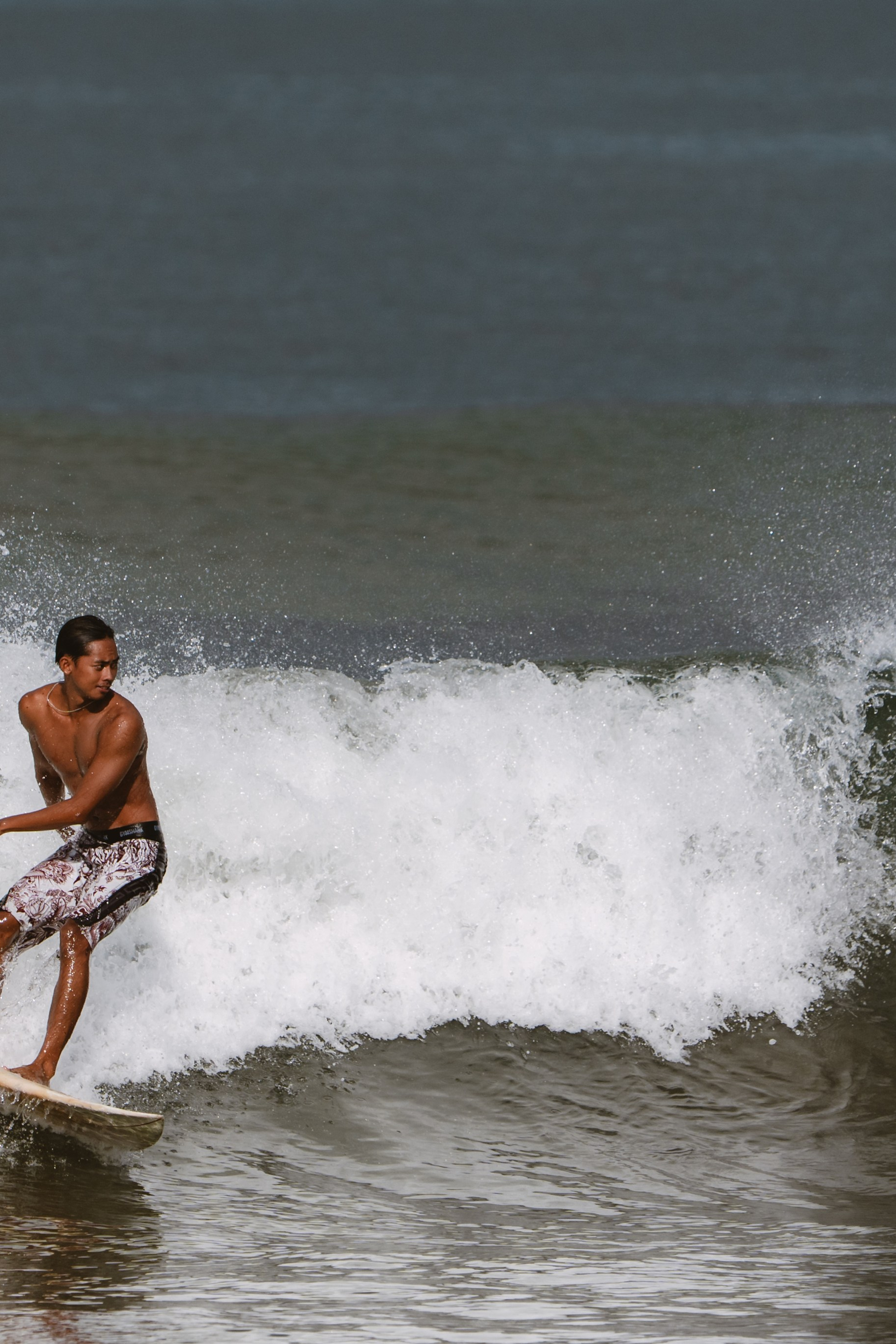 Mixed martial artists having fun surfing at the ocean in between training sessions. Сергей Зворыгин