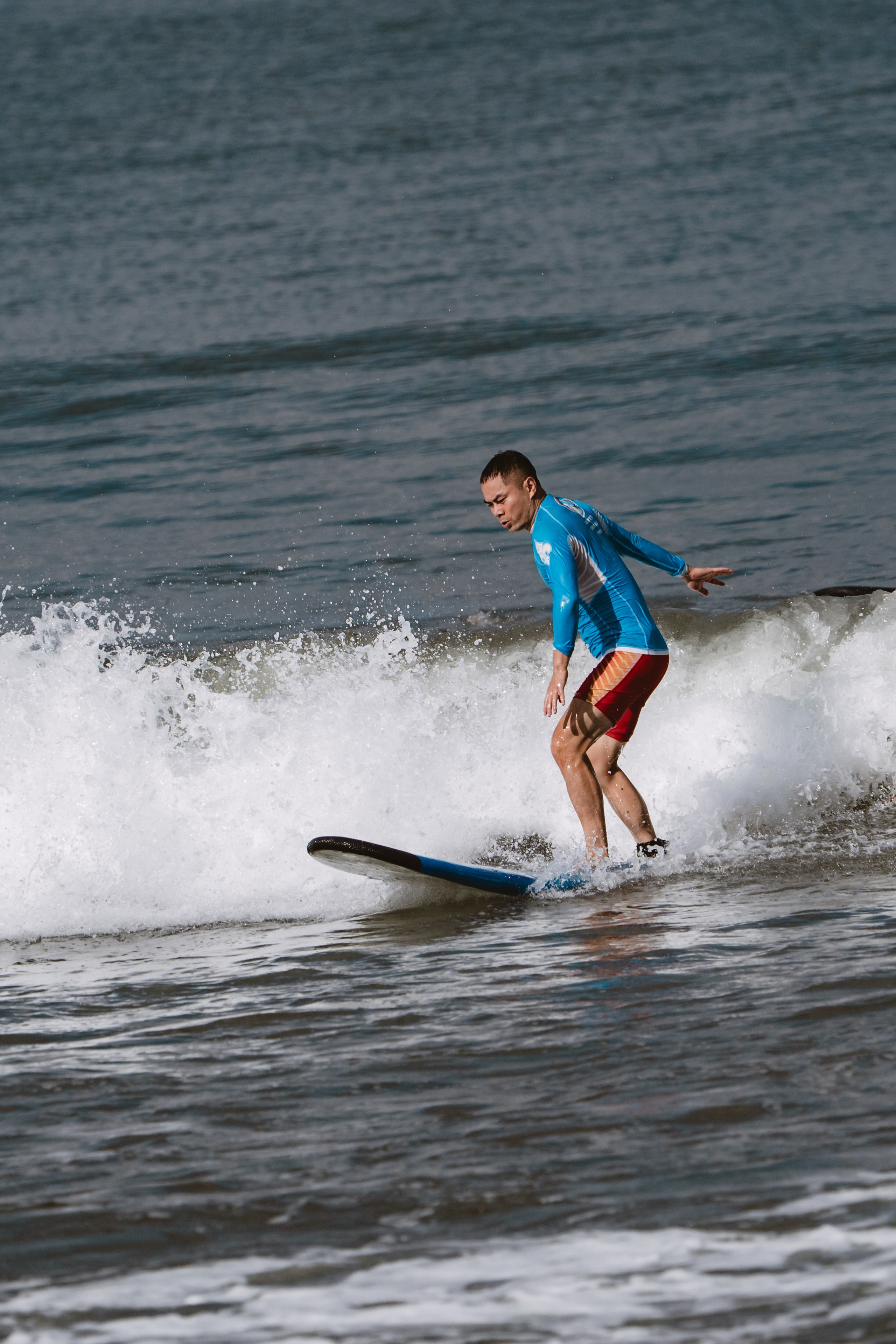 Mixed martial artists having fun surfing at the ocean in between training sessions. Сергей Зворыгин
