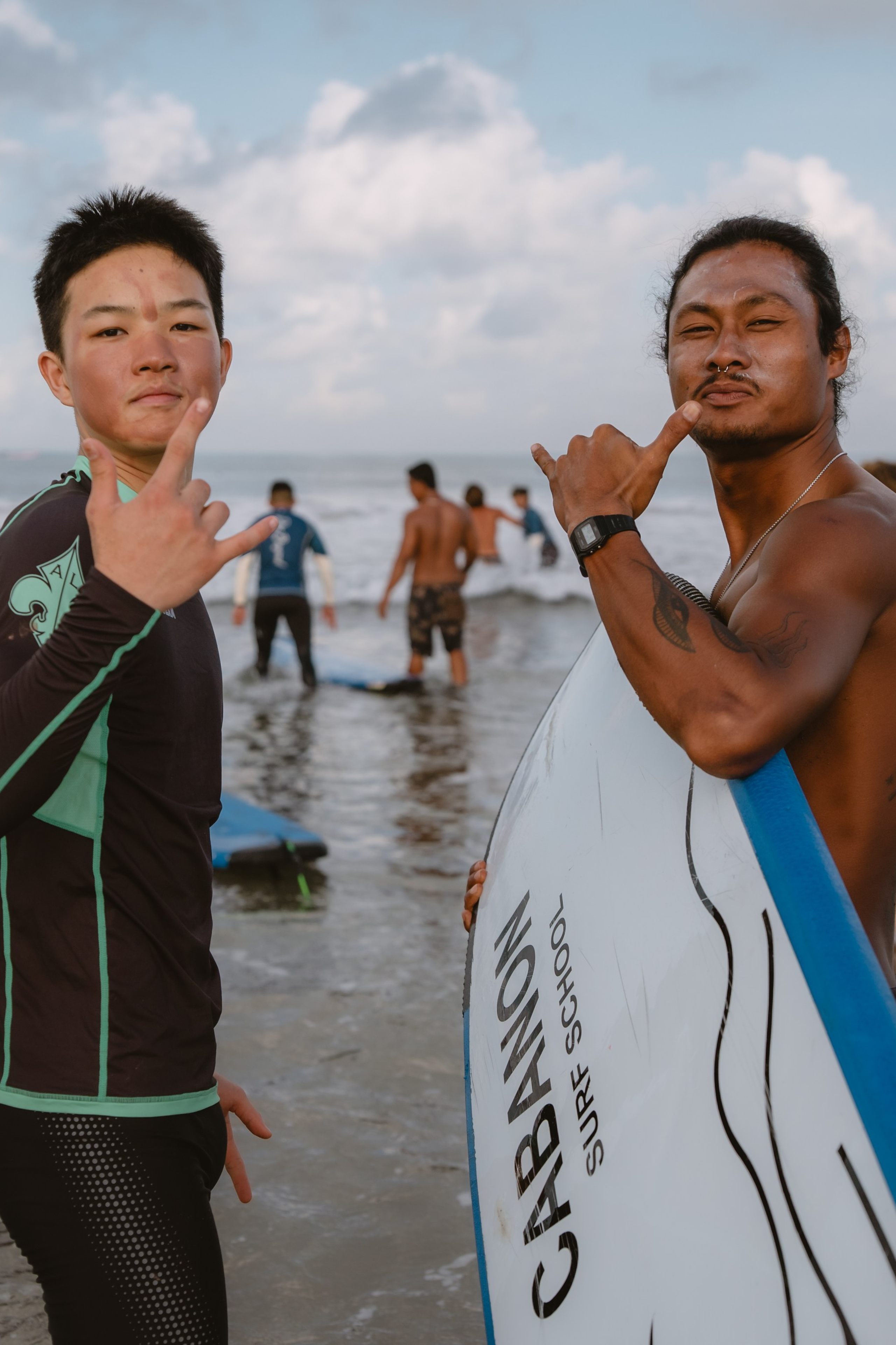 Mixed martial artists having fun surfing at the ocean in between training sessions. Сергей Зворыгин