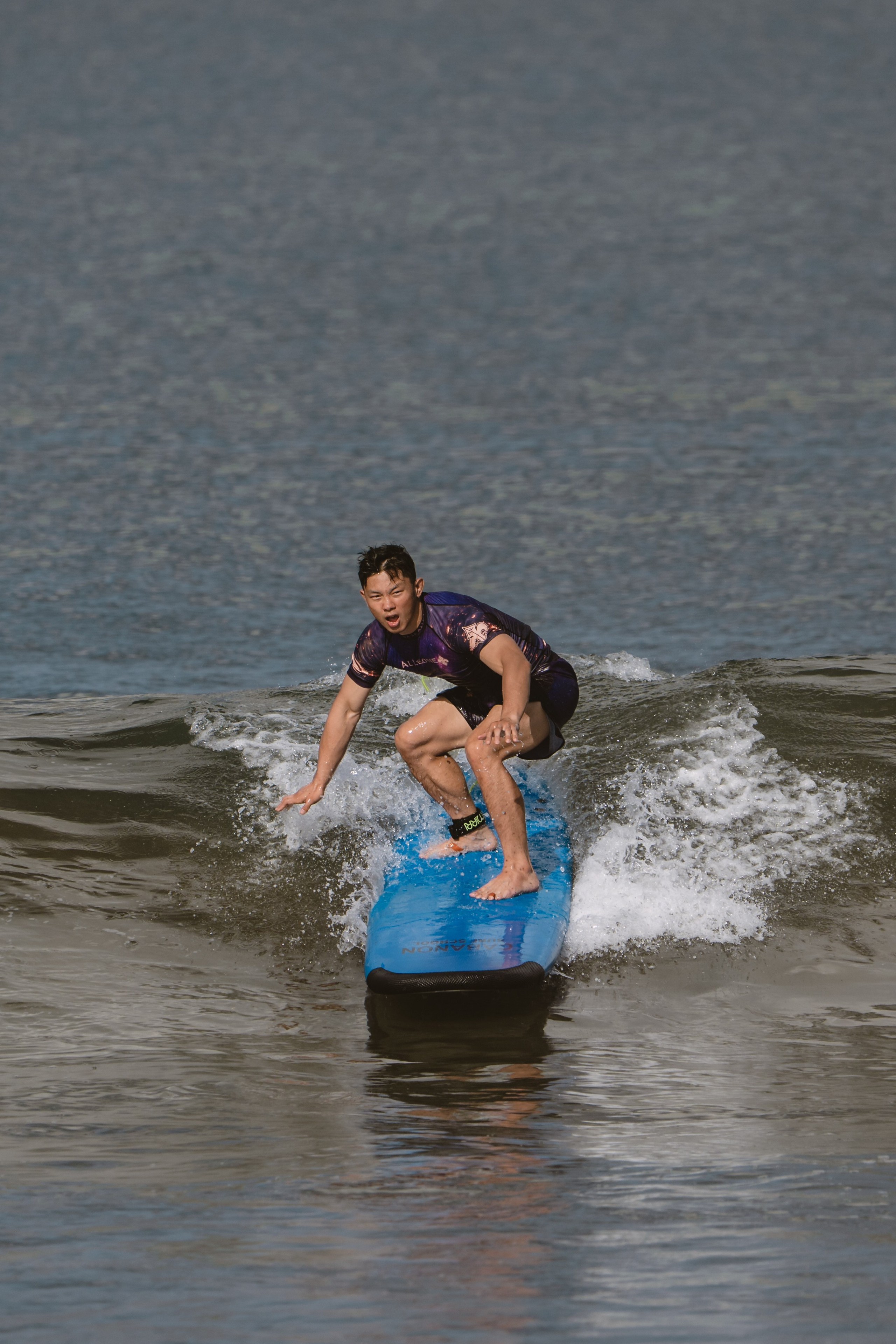 Mixed martial artists having fun surfing at the ocean in between training sessions. Сергей Зворыгин