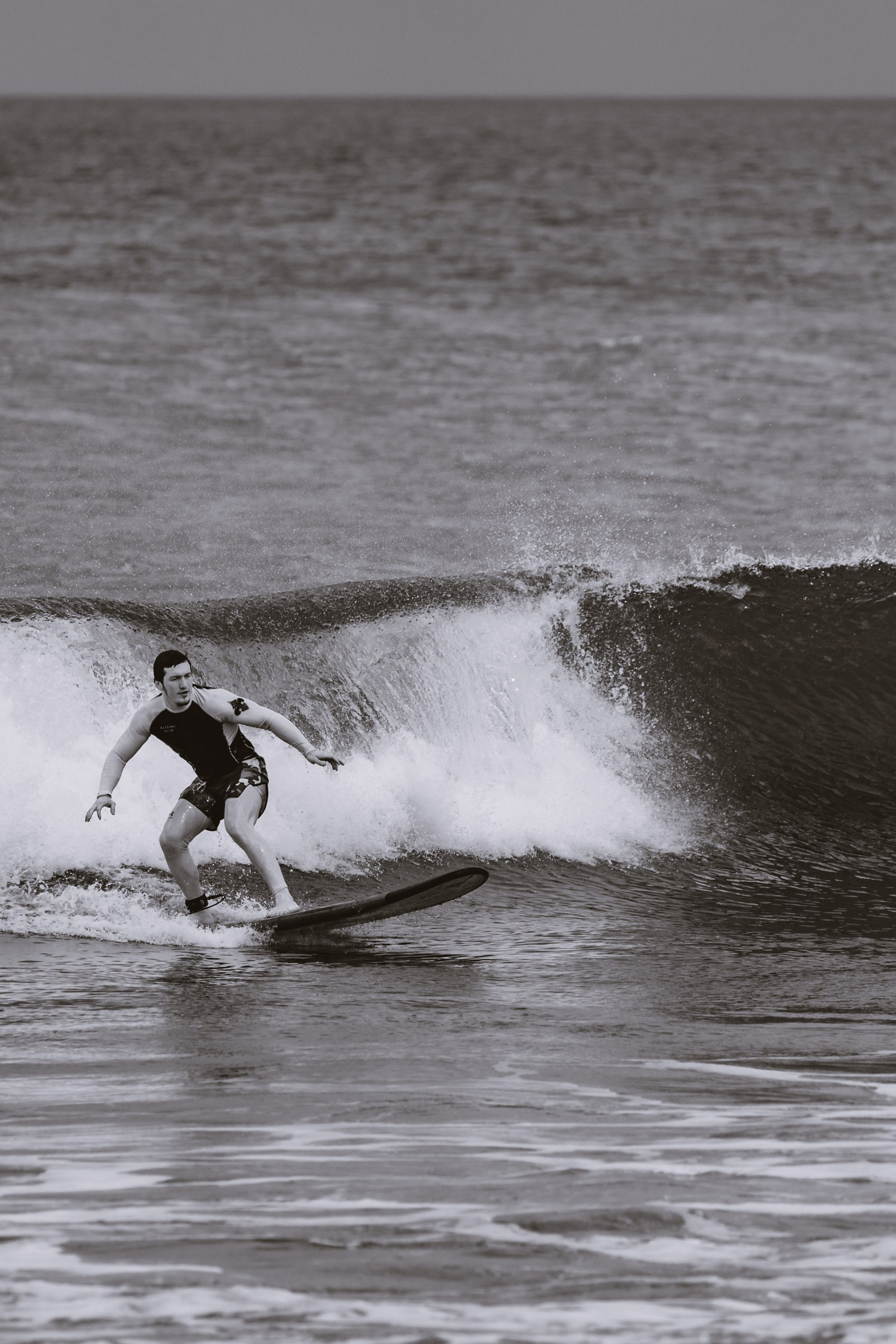 Mixed martial artists having fun surfing at the ocean in between training sessions. Сергей Зворыгин