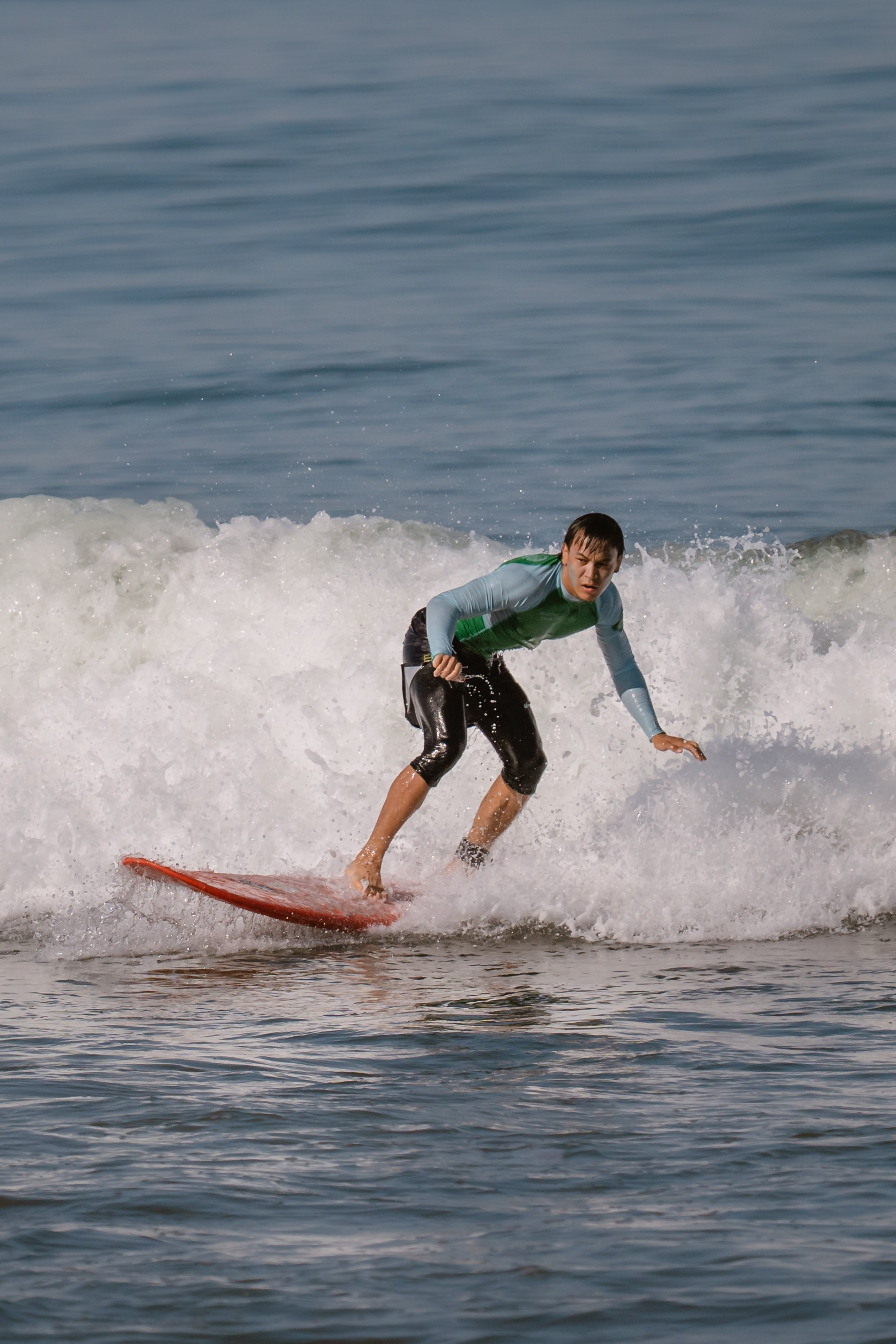 Al Leone athletes having fun surfing in the Pacific Ocean. Сергей Зворыгин