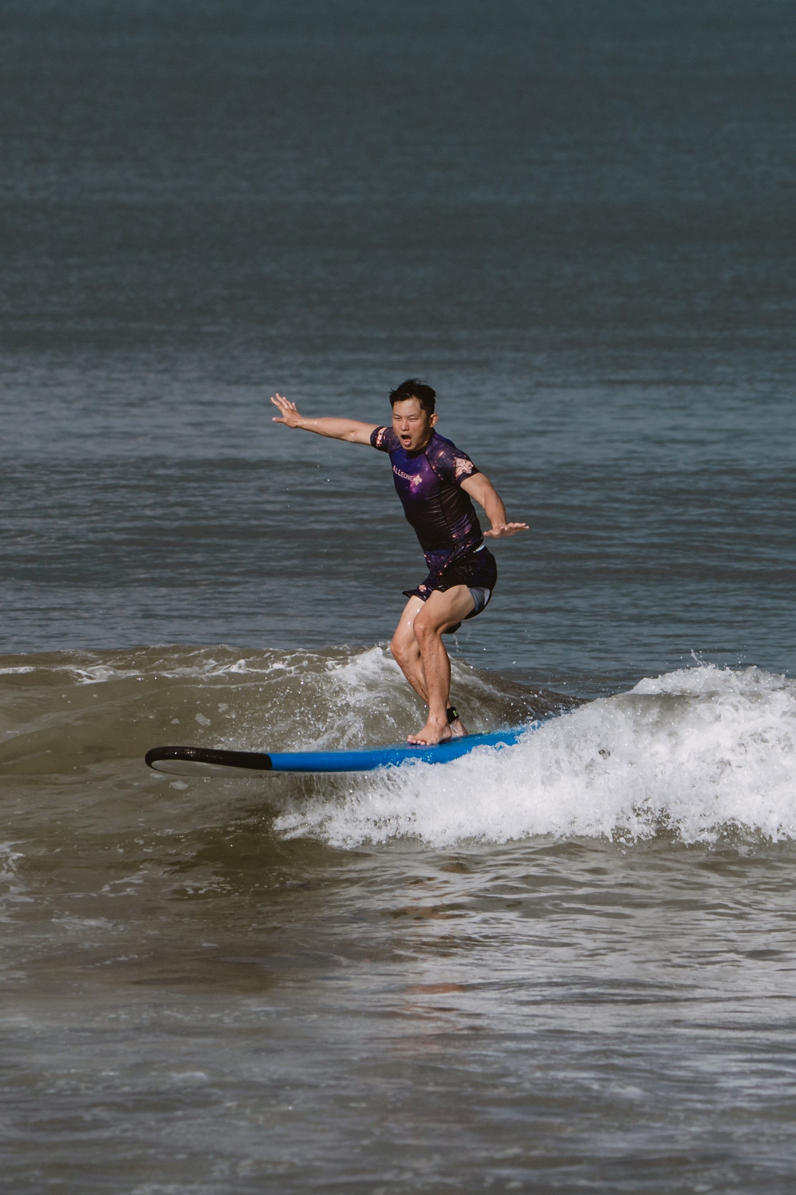 Mixed martial artists having fun surfing at the ocean in between training sessions. Сергей Зворыгин