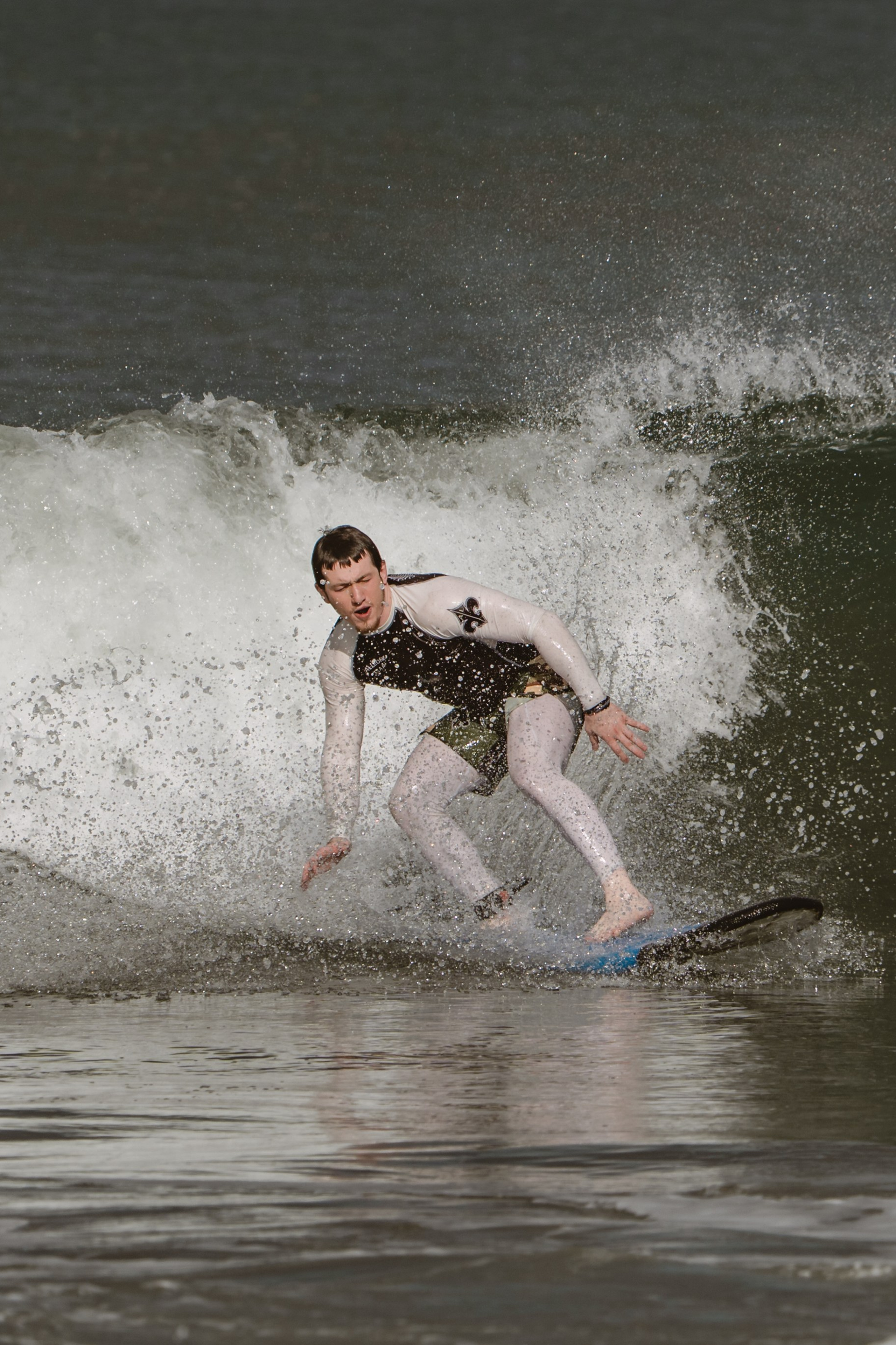 Mixed martial artists having fun surfing at the ocean in between training sessions. Сергей Зворыгин