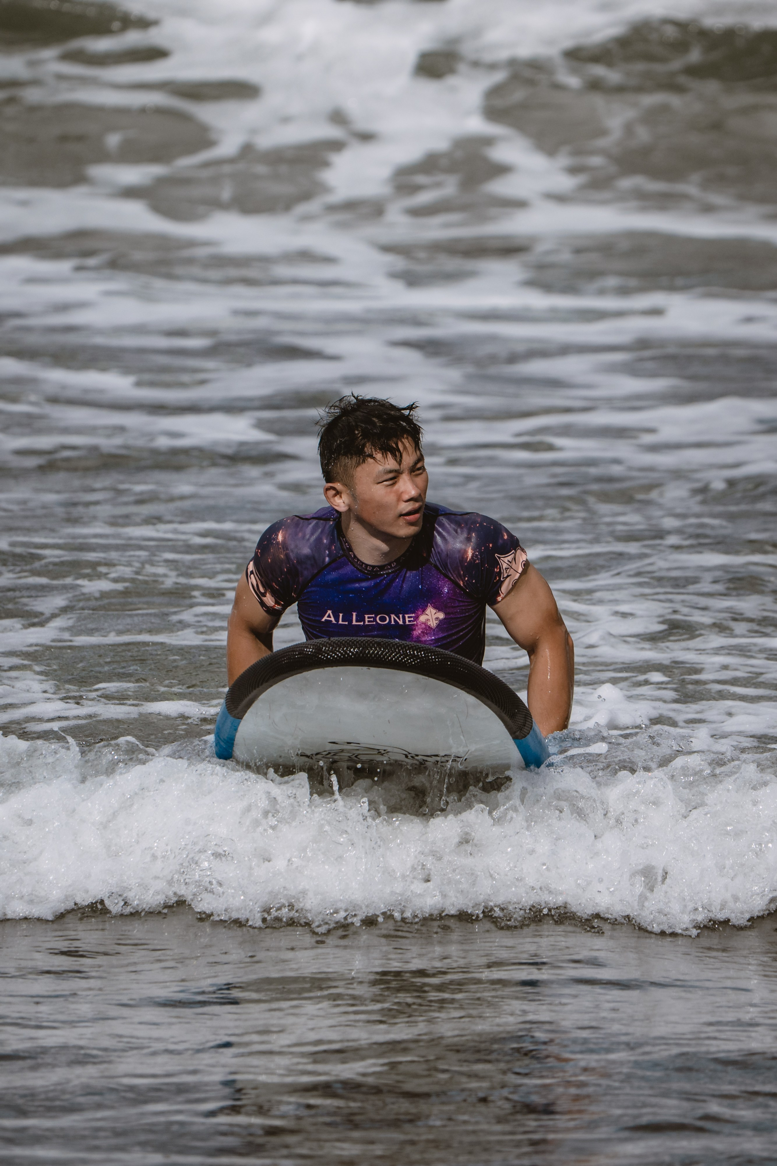 Mixed martial artists having fun surfing at the ocean in between training sessions. Сергей Зворыгин