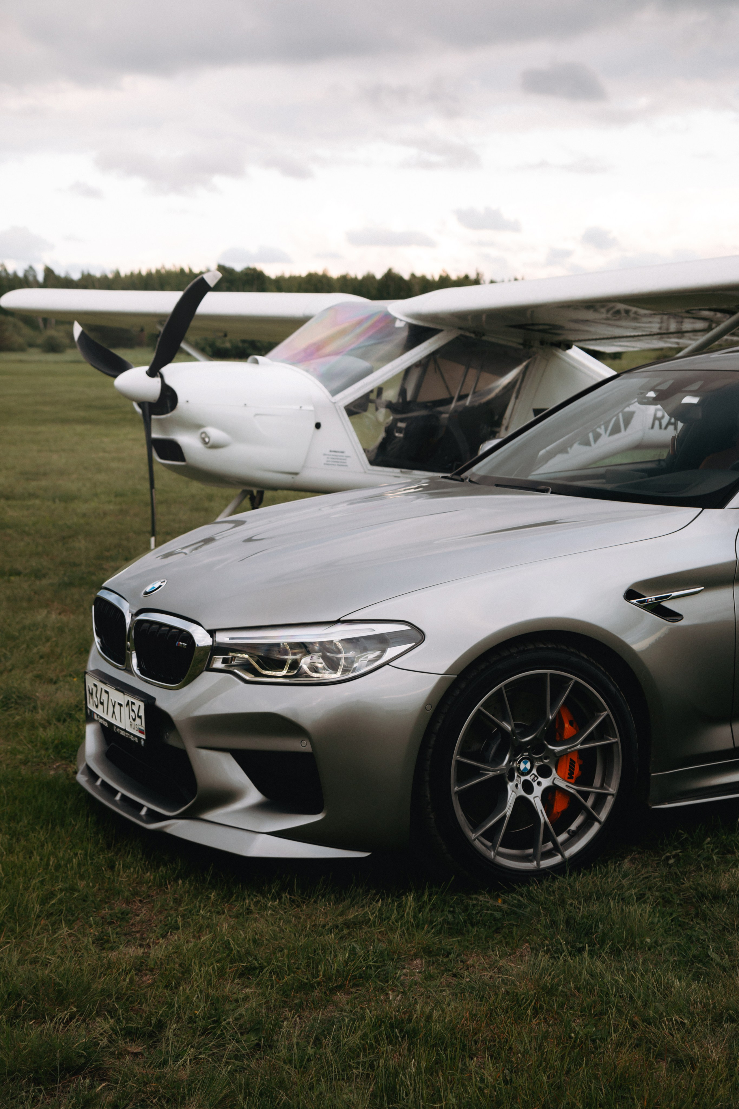 BMW M5 with plane