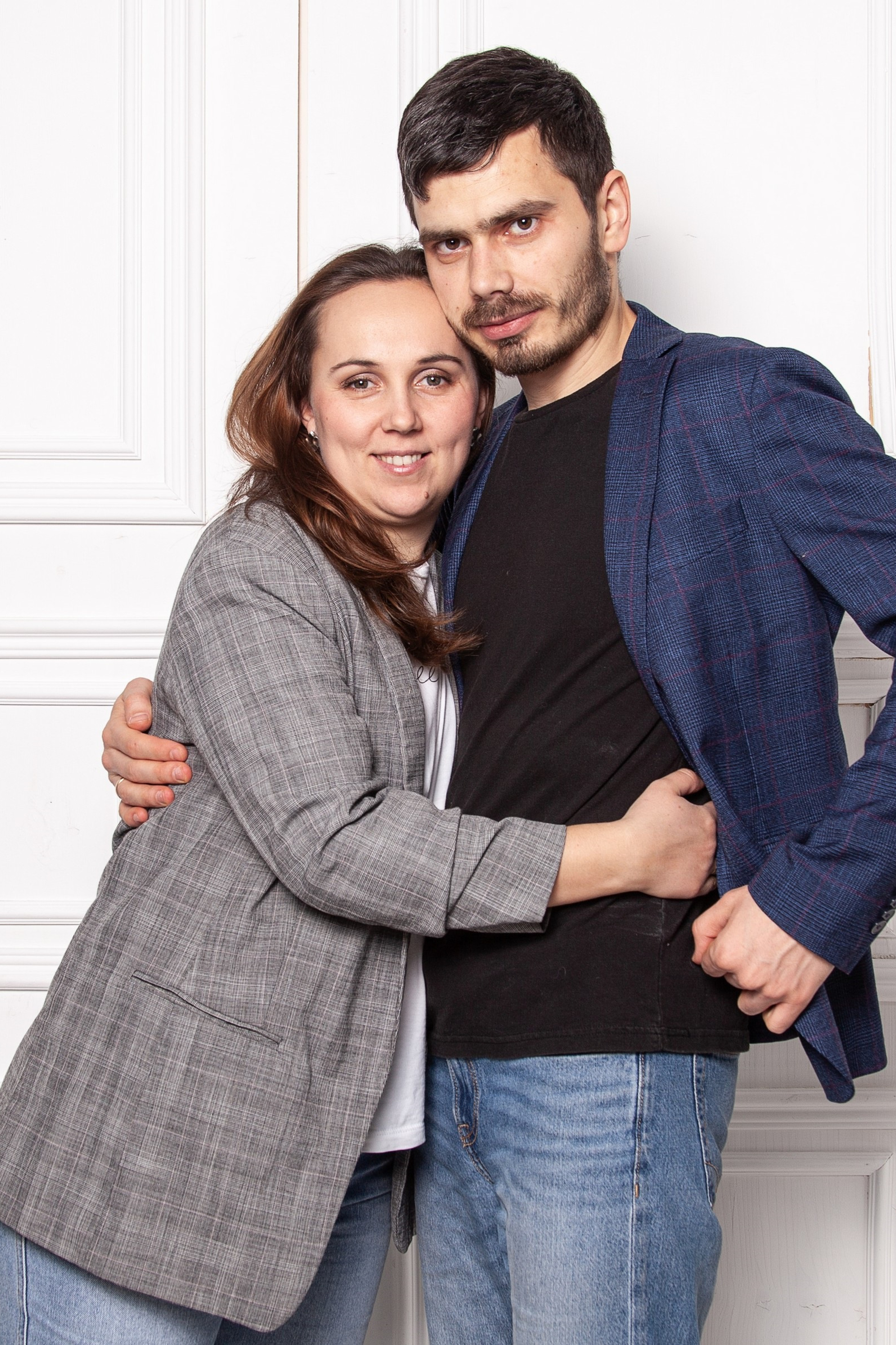 A happy family on the background of a beautiful natural landscape, smiling parents and children creating a warm and friendly atmosphere at a family photo shoot
