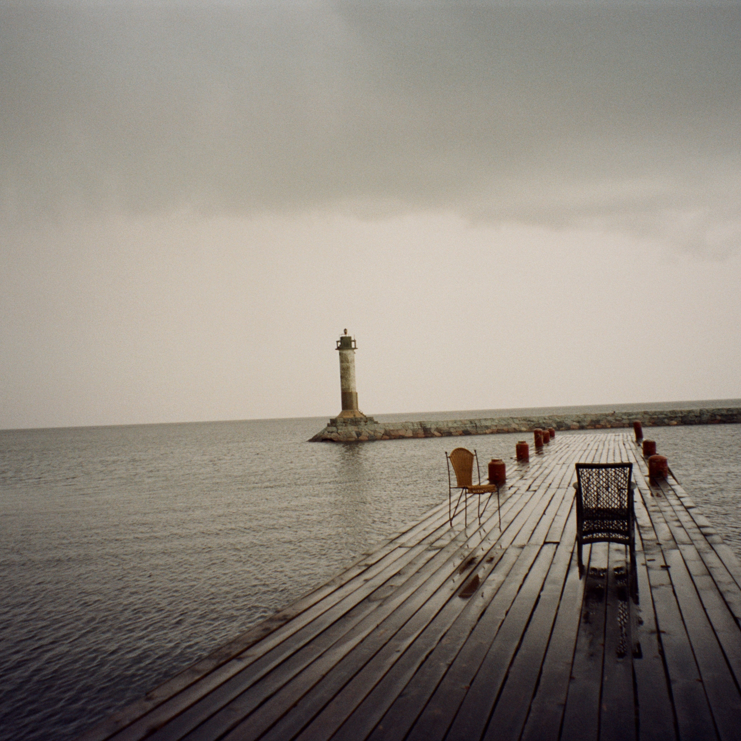 Маяк Вуохенсало в бухте Моторная и закат на озере Отрадное