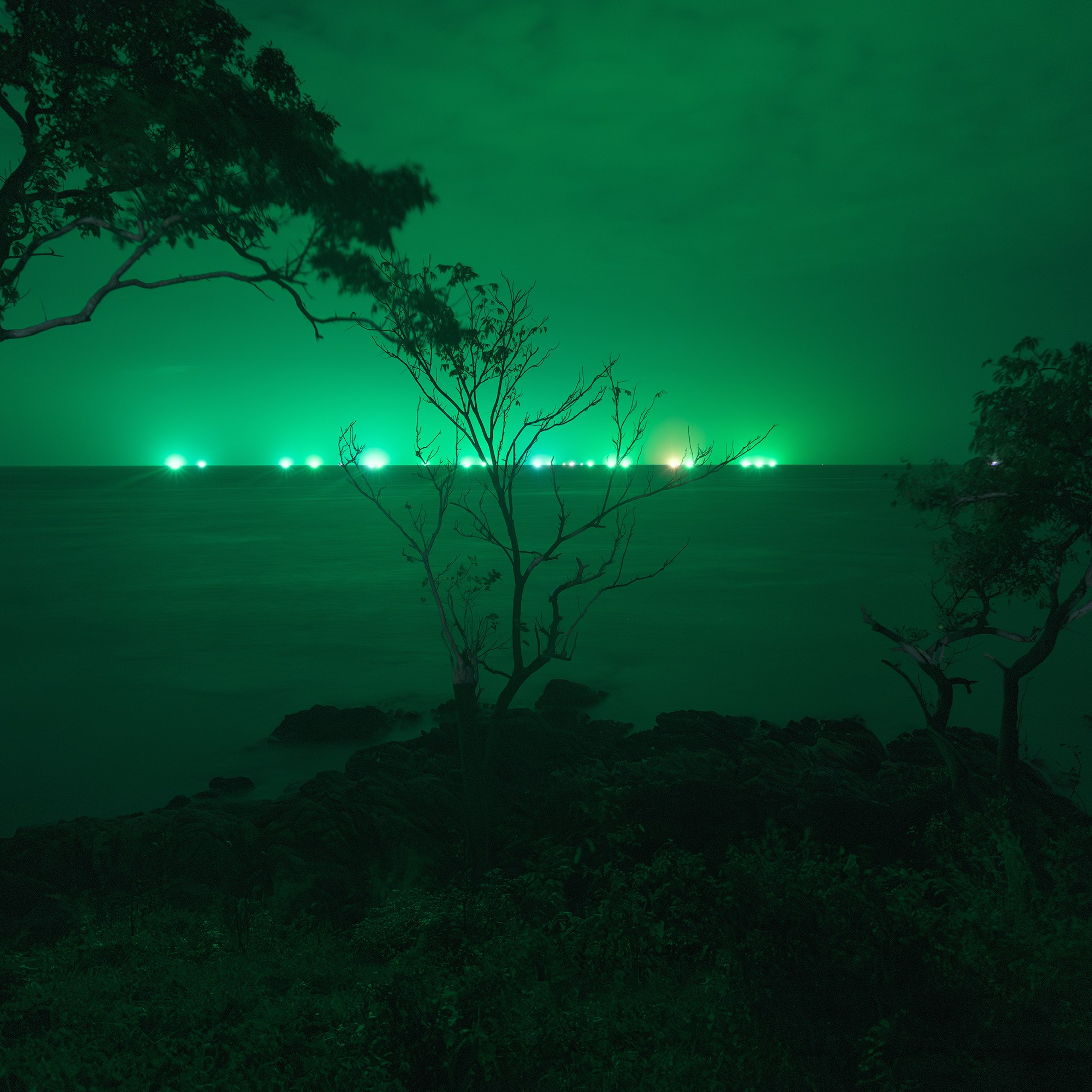 Ships at night in Thailand shelter from the tsunami. Ships in the Andaman Sea at night.