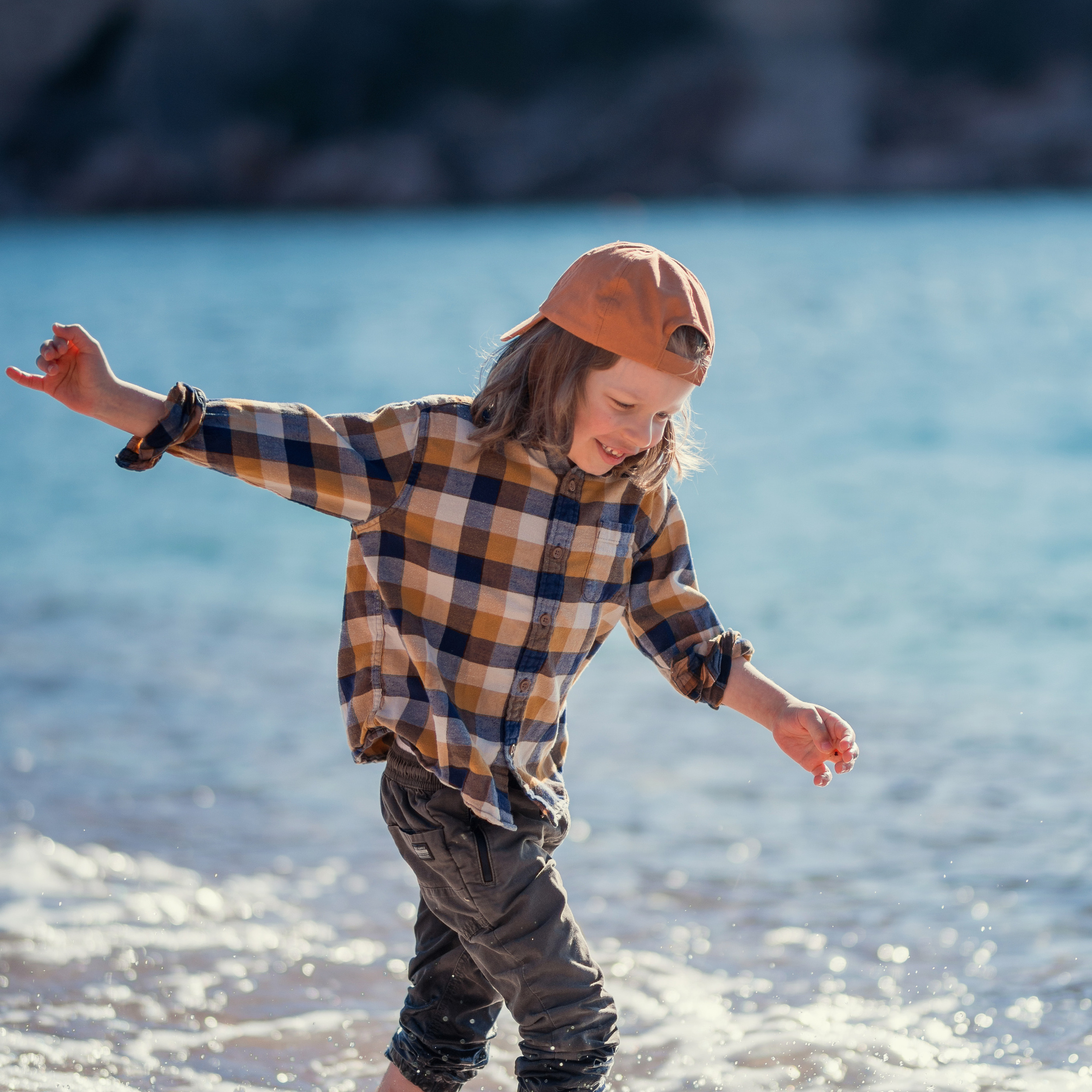 Photo session of a child playing on Milocher Beach in Budva