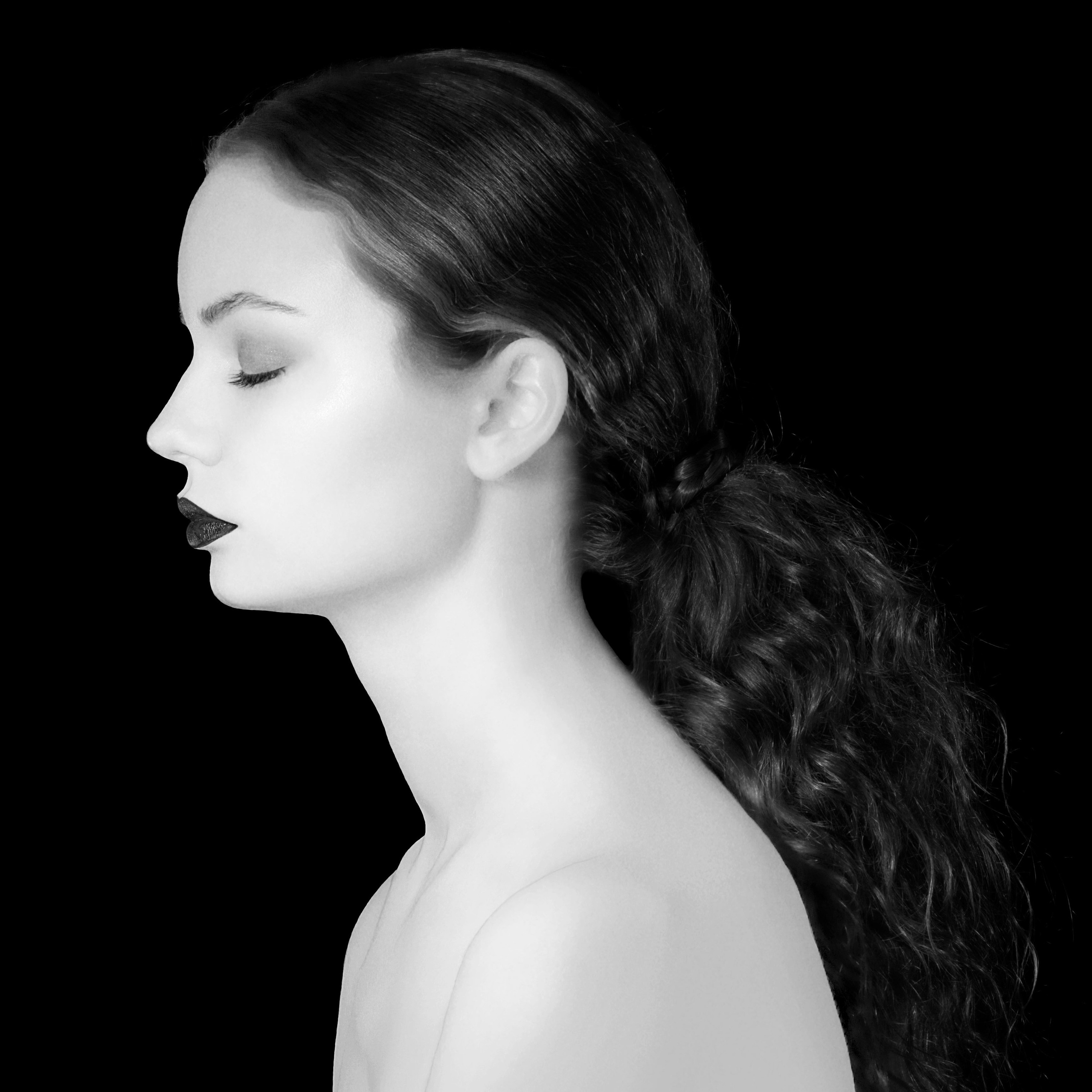 Profile of a girl in a black and white photograph