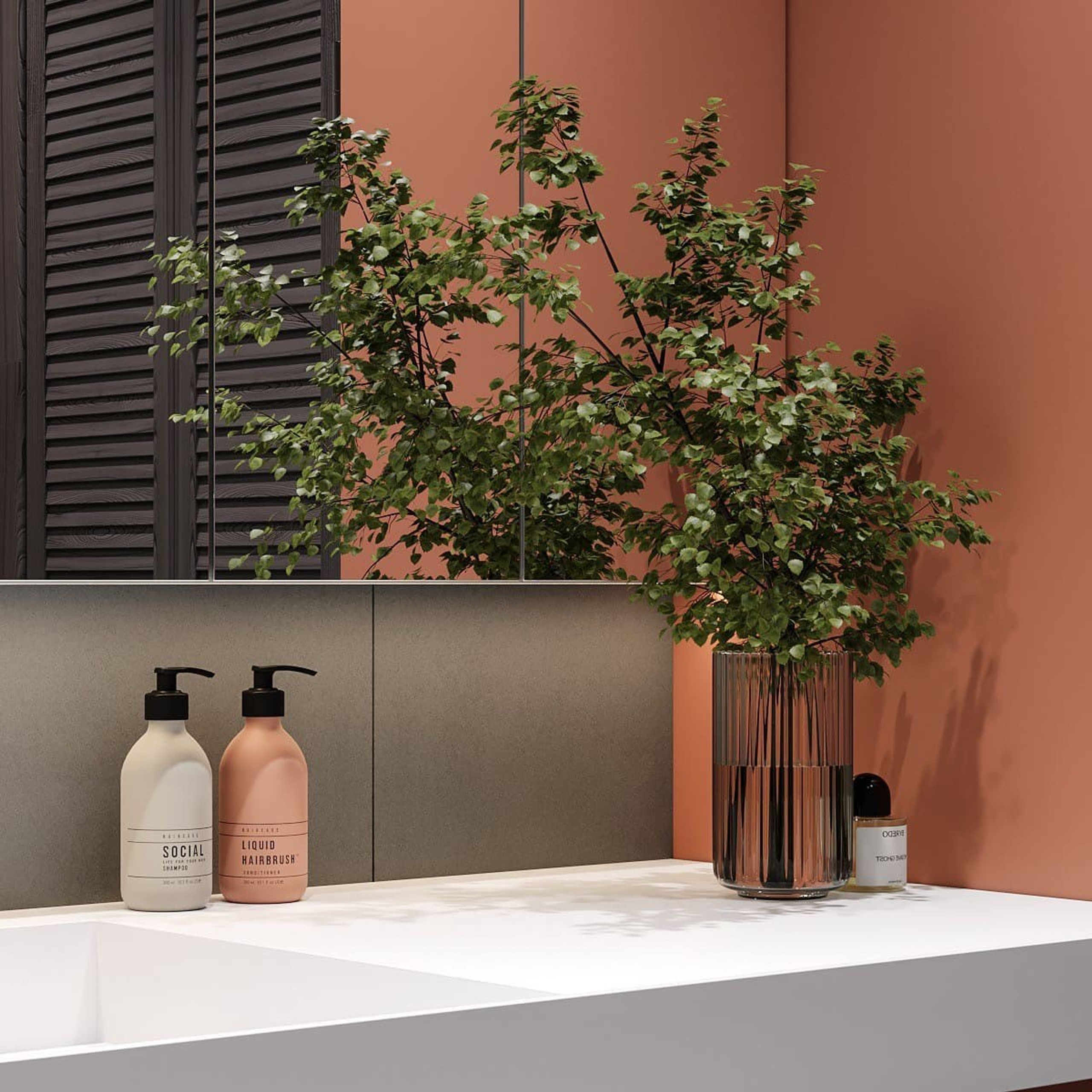 Аксессуары на раковине в терракотовом санузле: флаконы и ваза с зеленью.