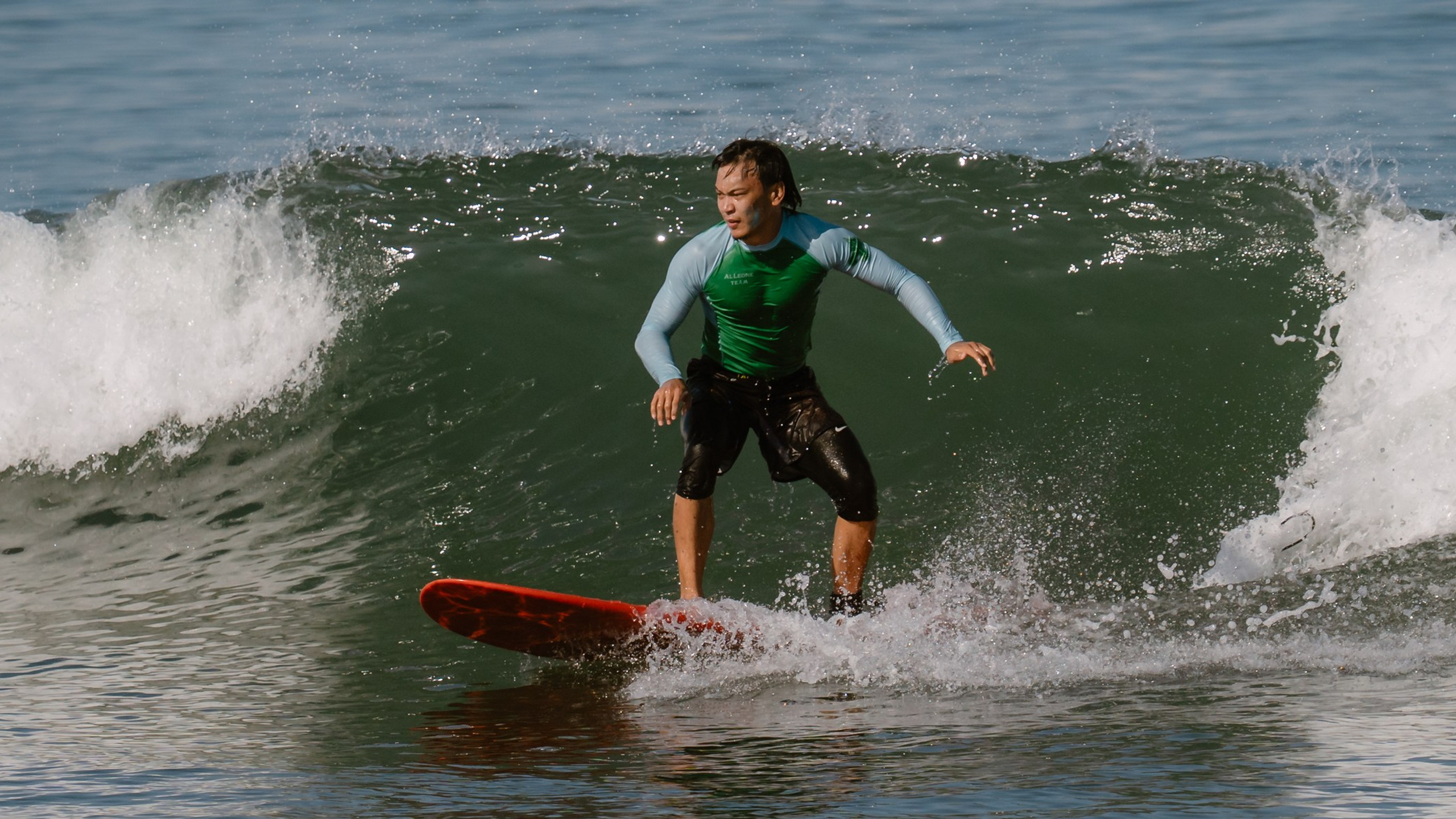 Al Leone athletes having fun surfing in the Pacific Ocean