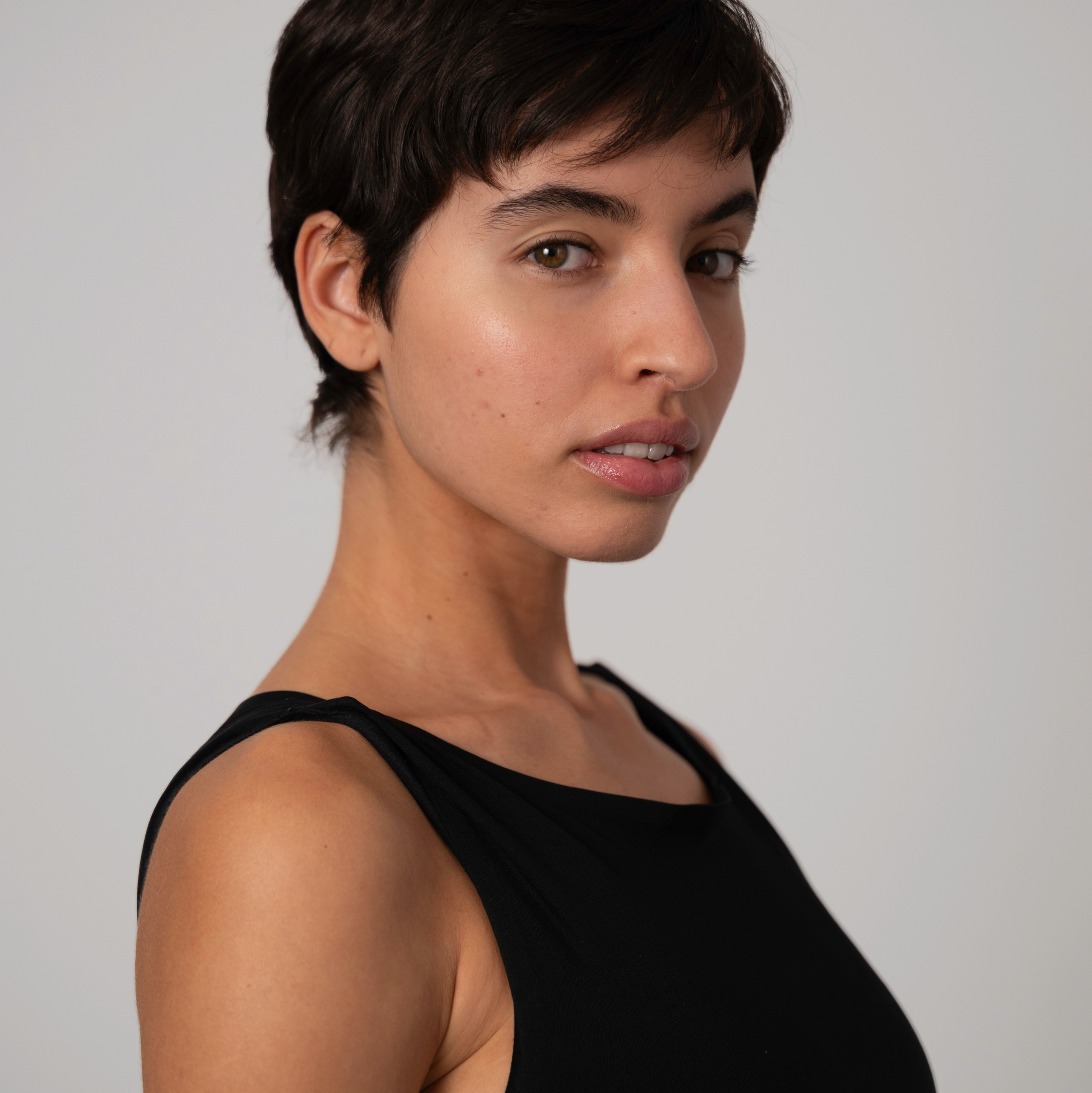 Side-angle model portrait in a black top