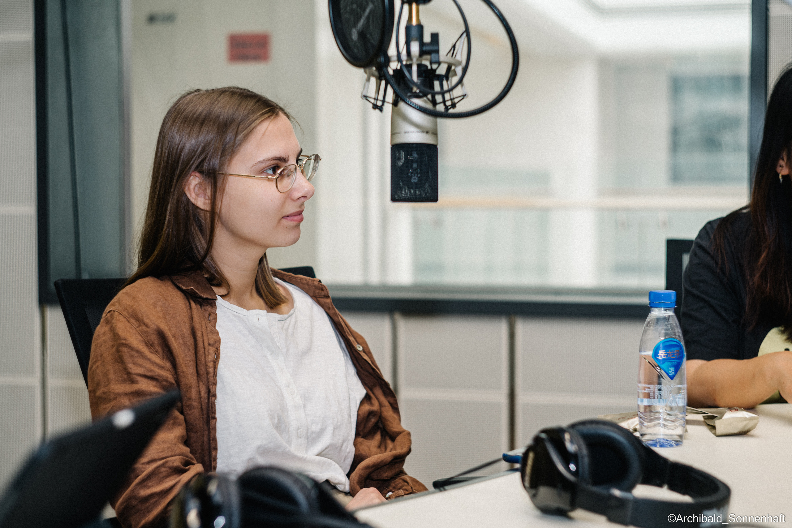 Campaign to the radio station. Photographer in Guangzhou, China. Archibald Sonnenhaft