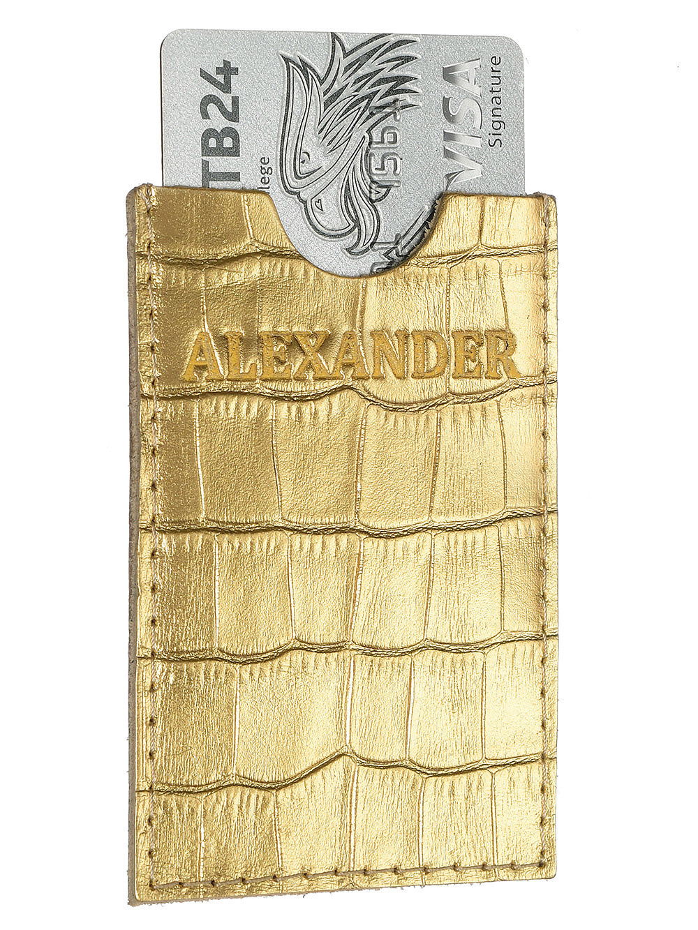 Кредитница золотого цвета из крокодиловой кожи на белом фоне.