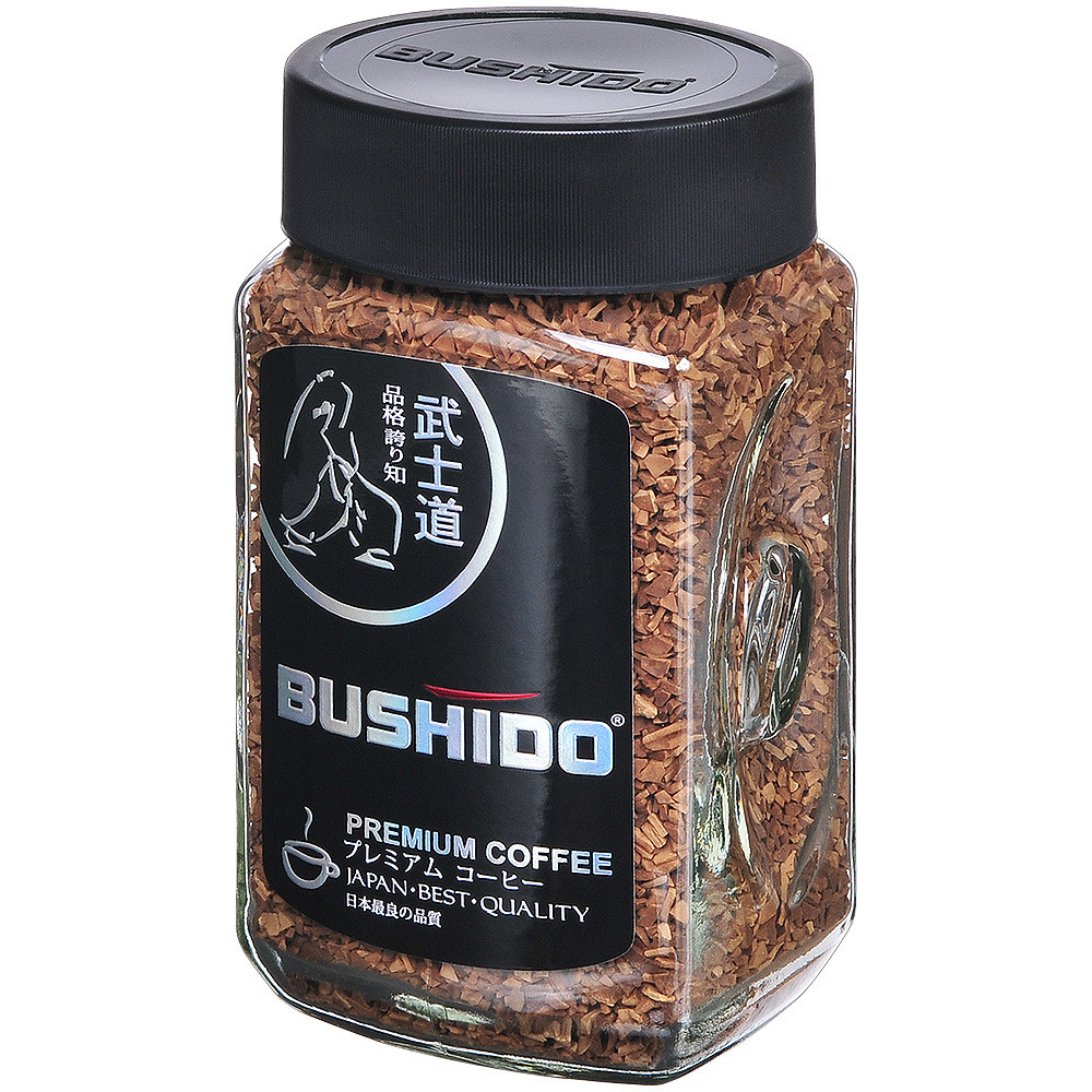 Кофе растворимый в стеклянной банке с чёрной этикеткой и чёрной крышкой.