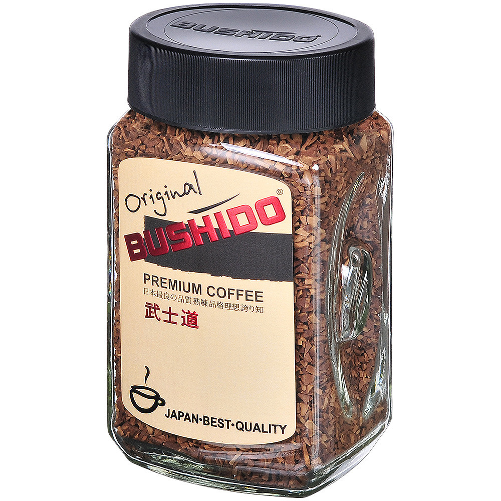 Кофе растворимый в стеклянной банке с желтой этикеткой и чёрной крышкой.