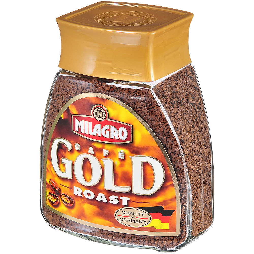 Кофе milagro растворимый в стеклянной банке с оранжевой этикеткой.