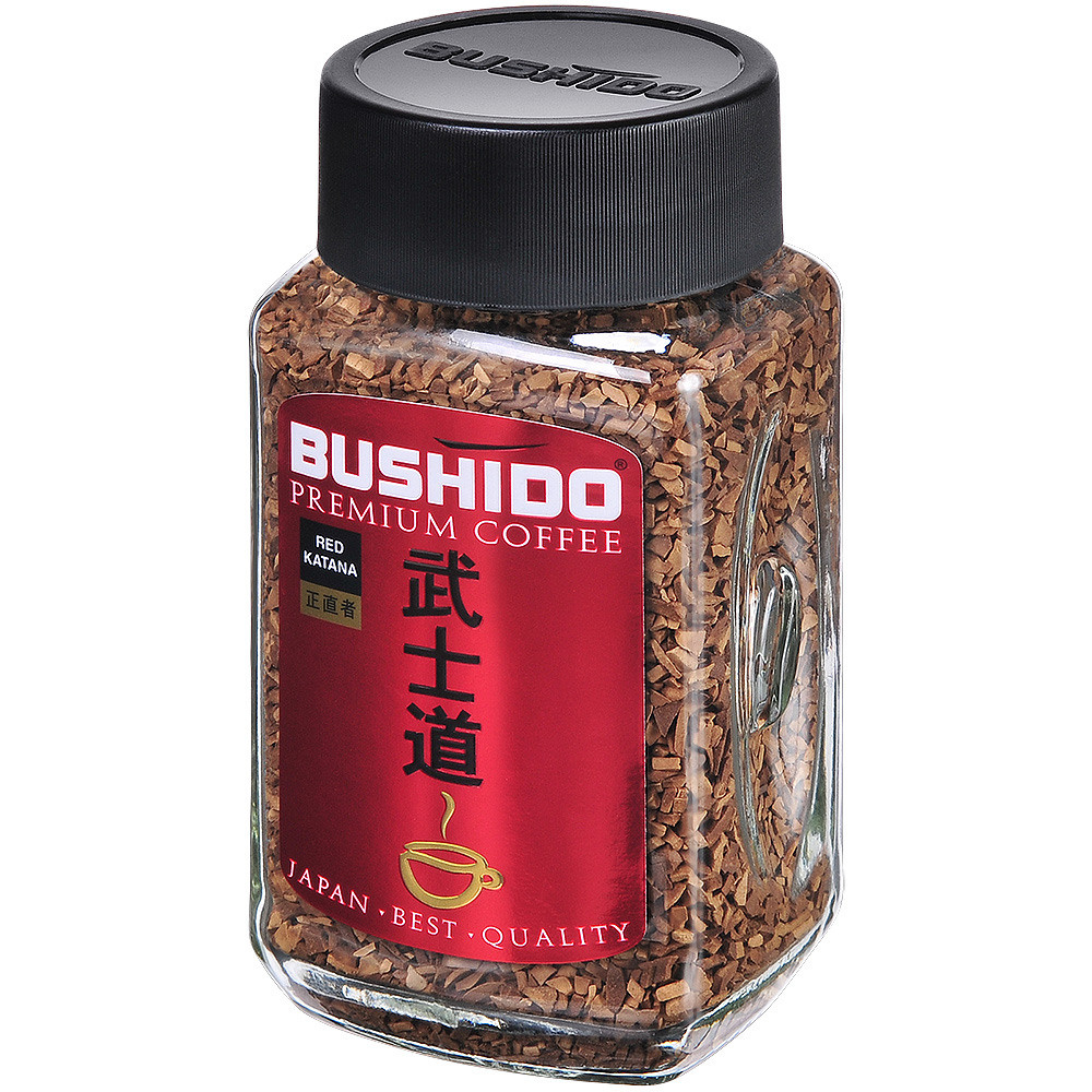 Кофе растворимый в стеклянной банке с красной этикеткой и чёрной крышкой.