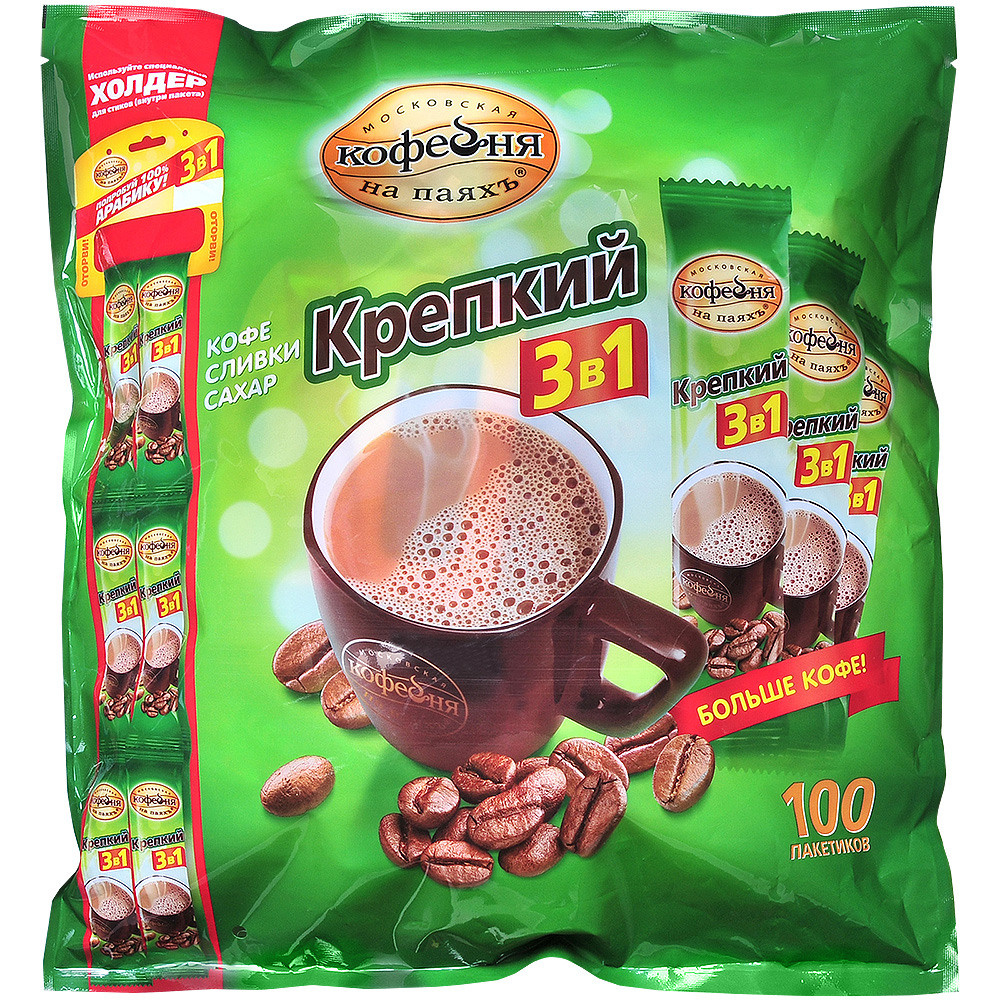 Зелёная упаковка с пакетиками быстрорастворимого кофе.