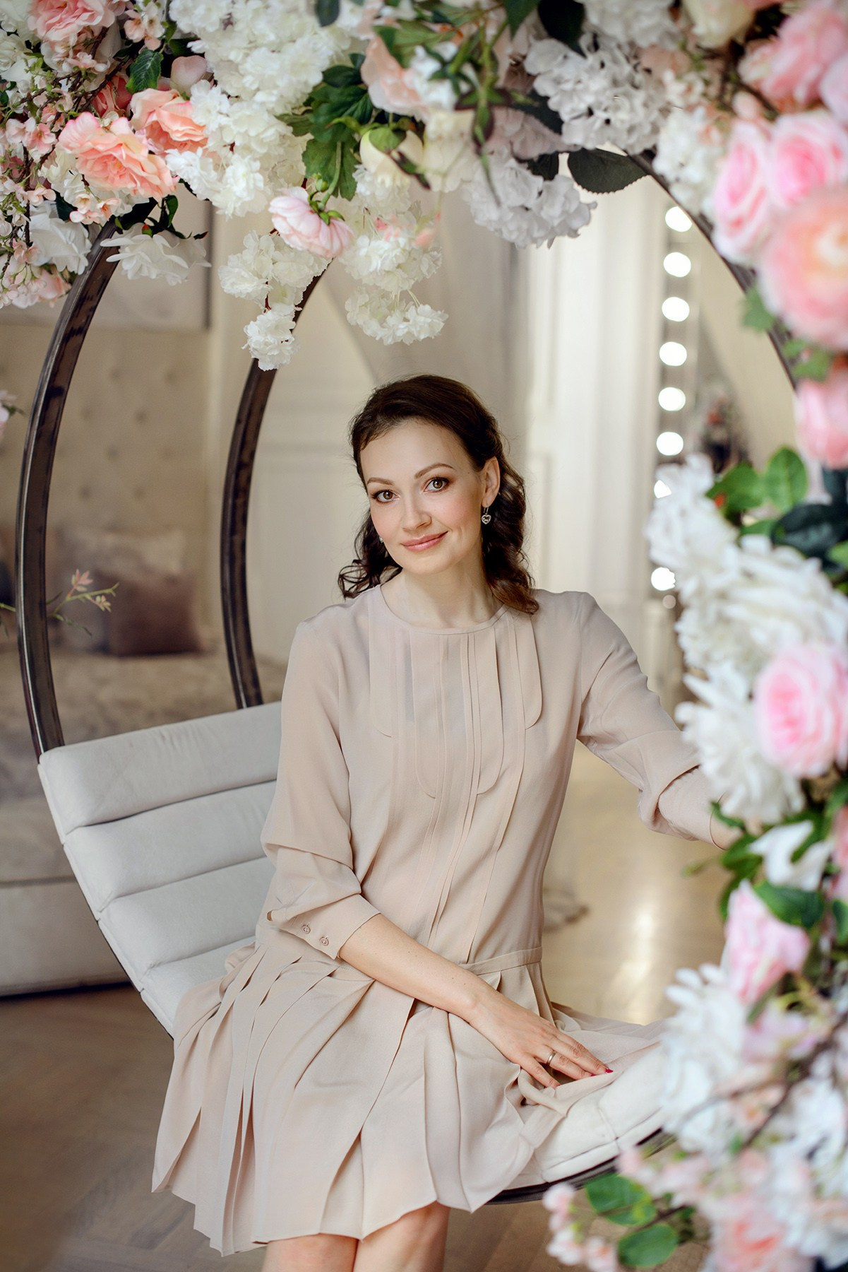 mom and daughter in blooming flower, arch. Photo shoot in the studio in the spring