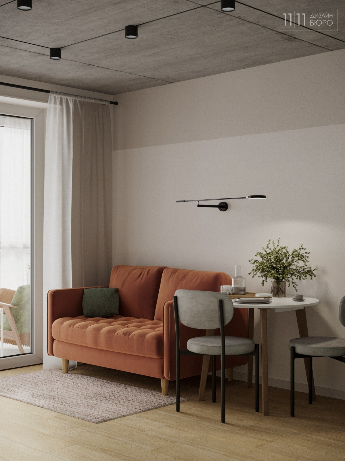 Интерьер маленькой кухни-гостиной с оранжевым диваном