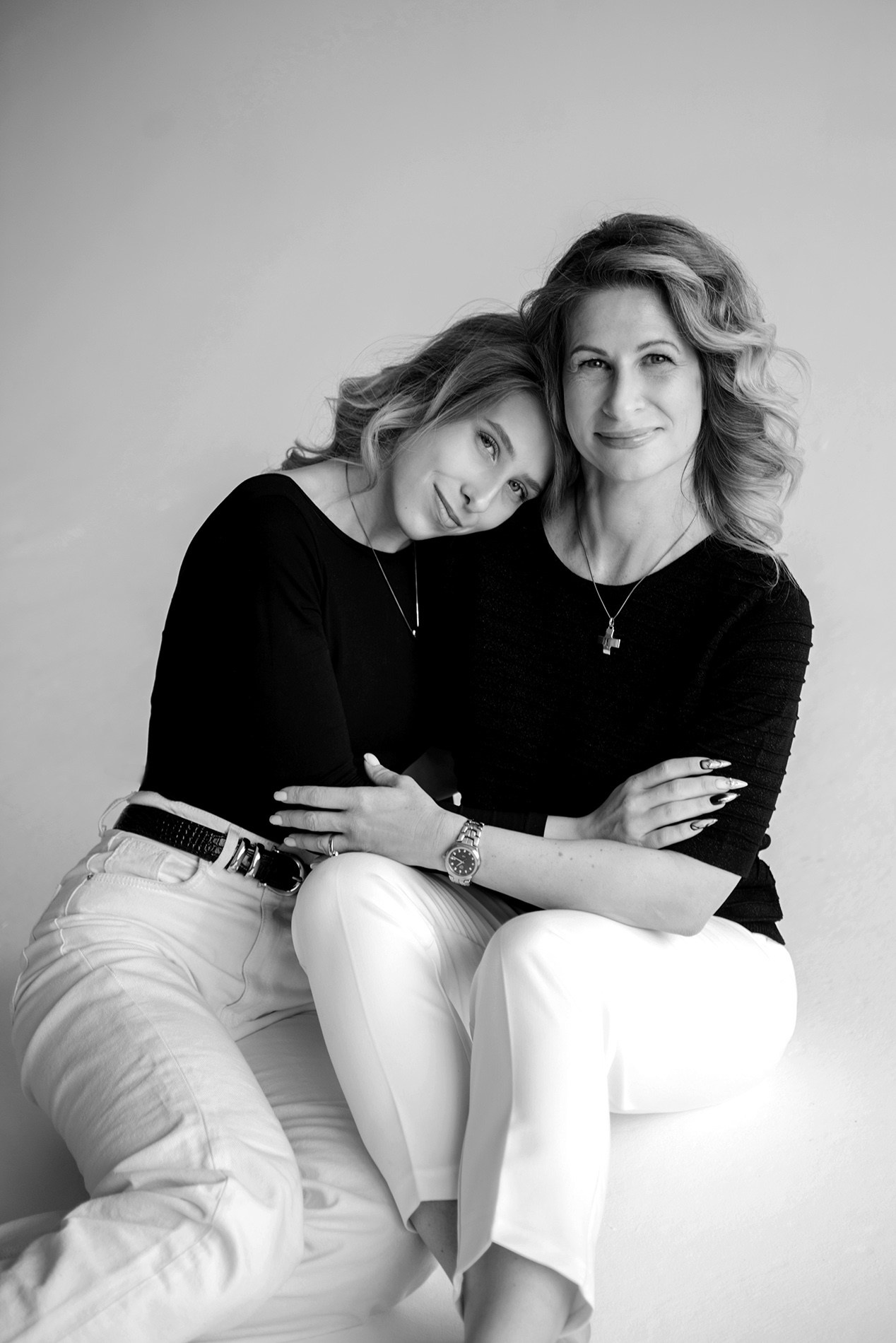 photo shoot for mom and daughter in the studio bw black and white
