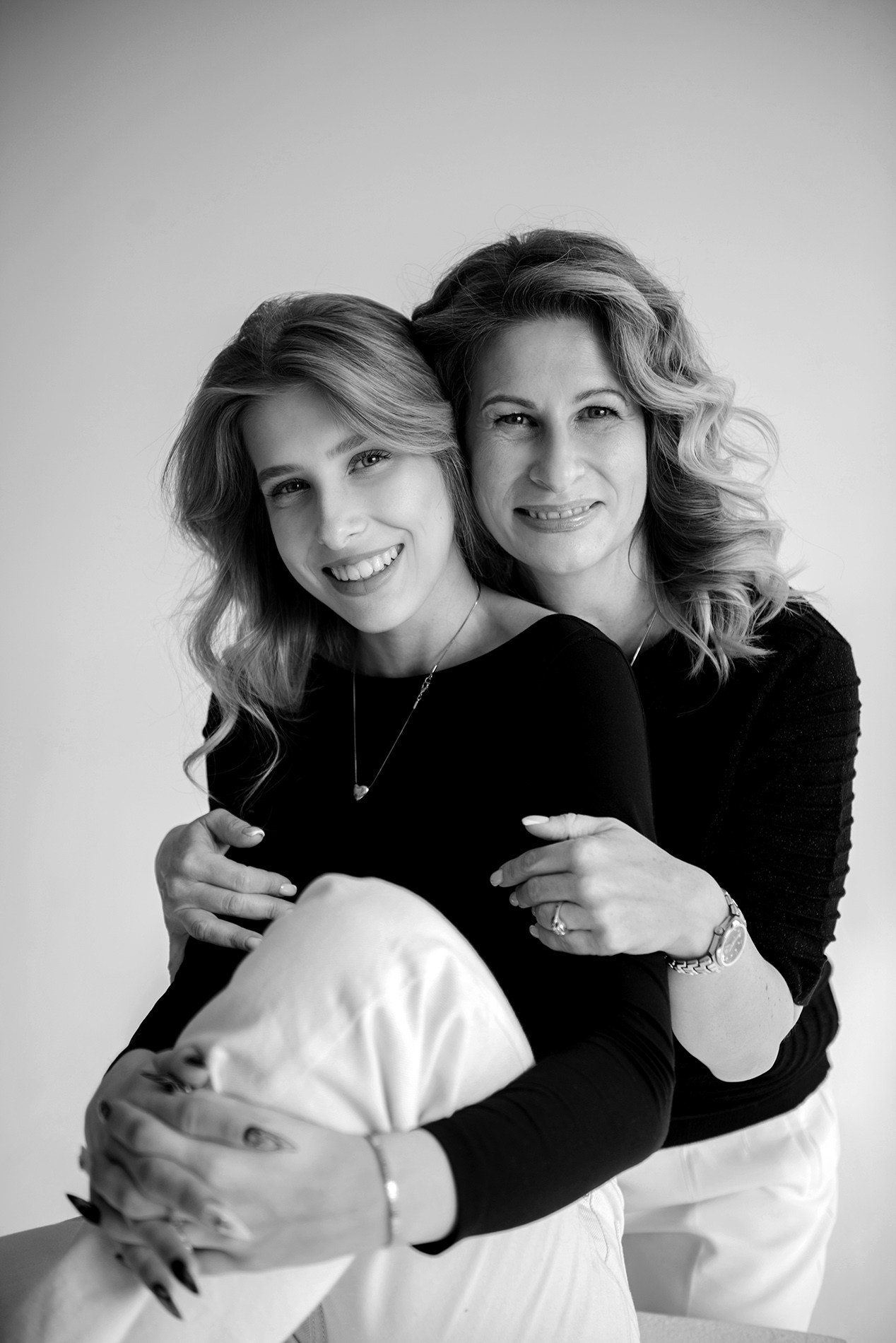 photo shoot for mom and daughter in the studio bw black and white