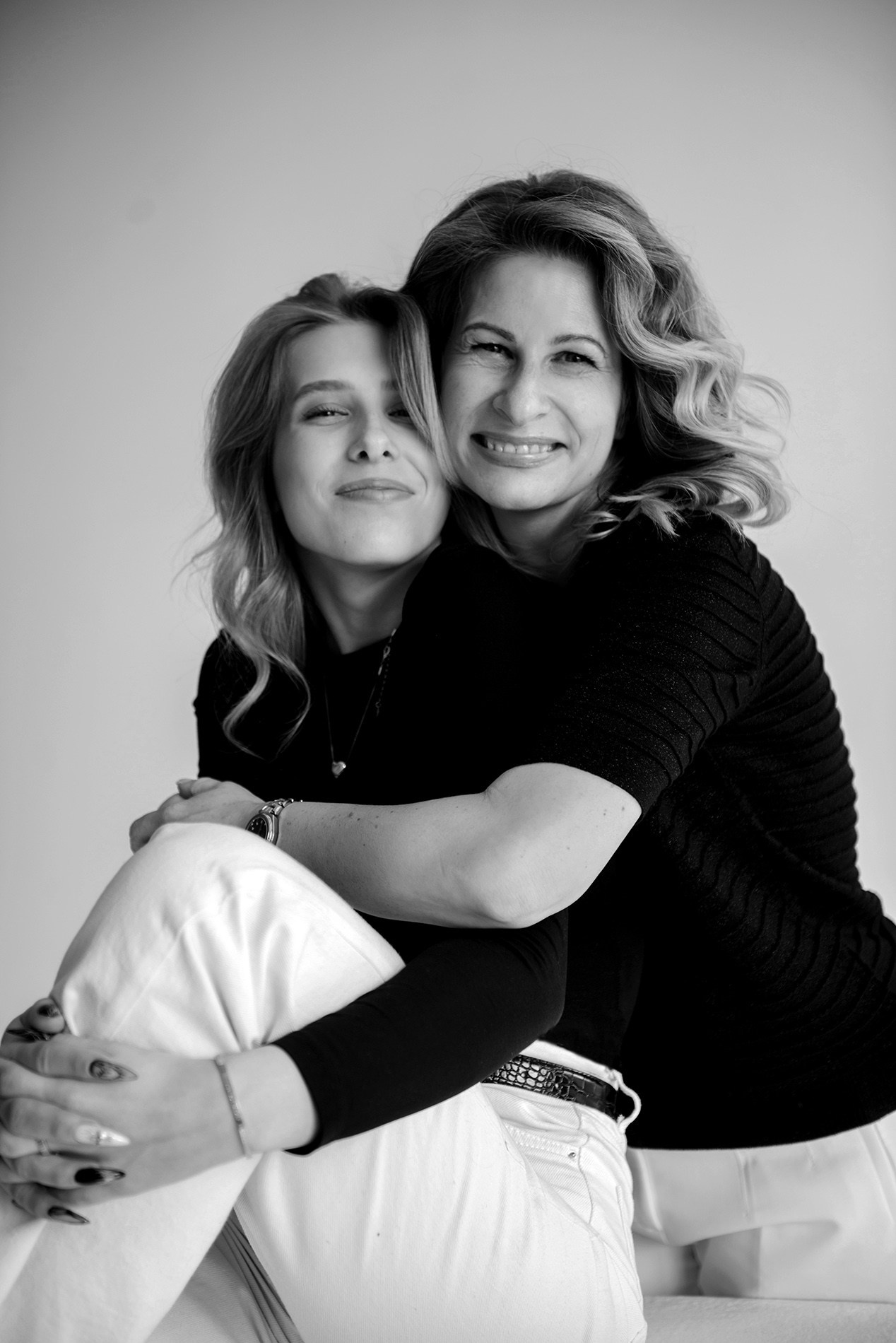 photo shoot for mom and daughter in the studio bw black and white