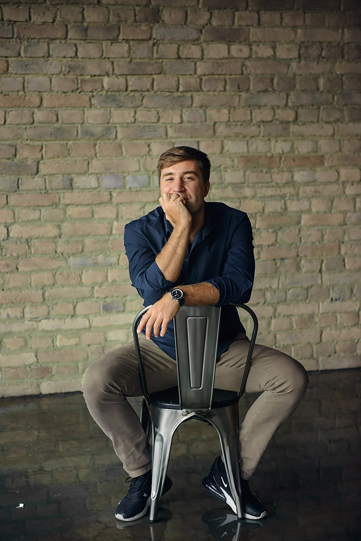 man in a dark photo studio