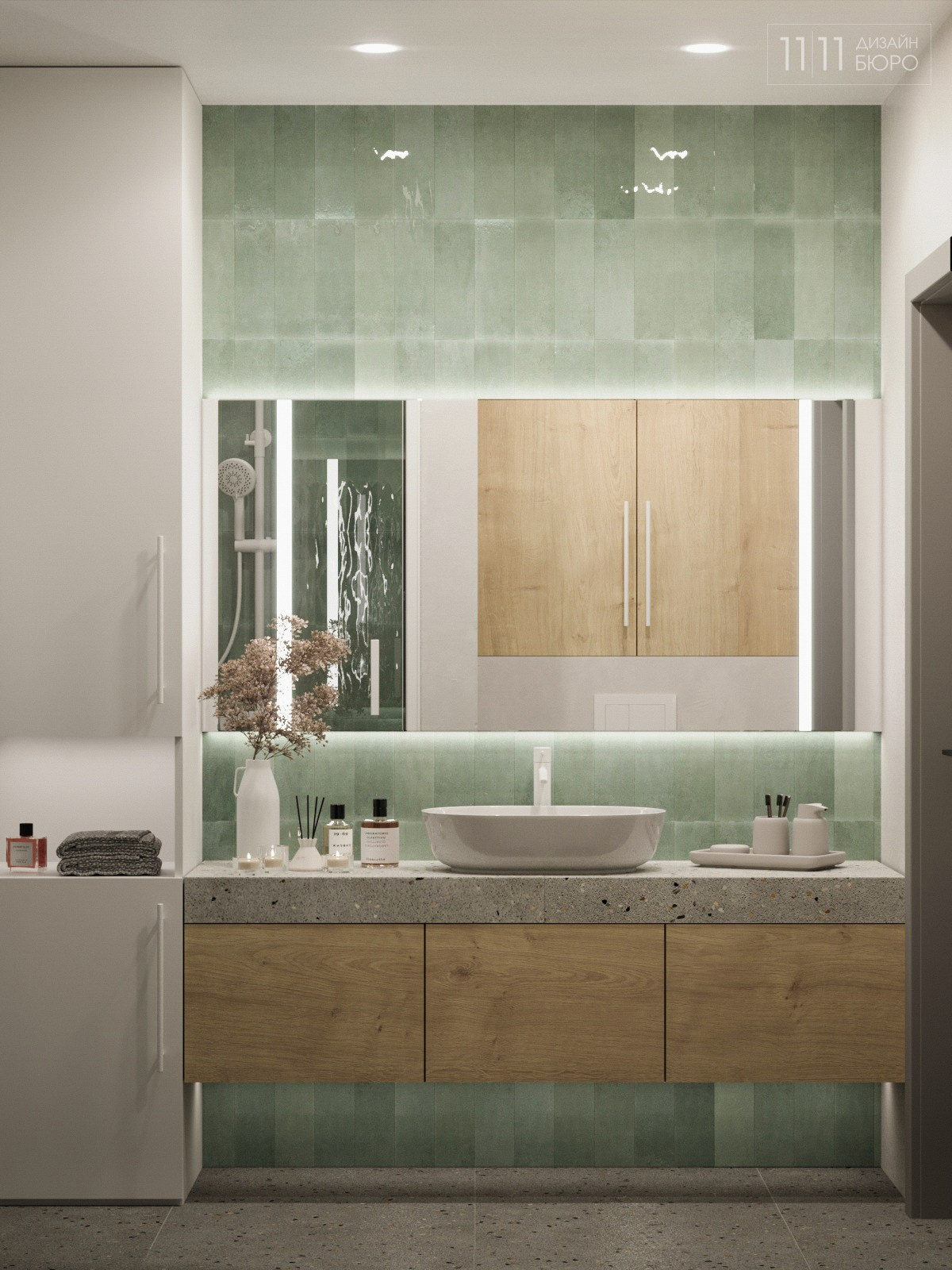 Интерьер ванной с зеленой мелкой плиткой и большим зеркалом с подсветкой