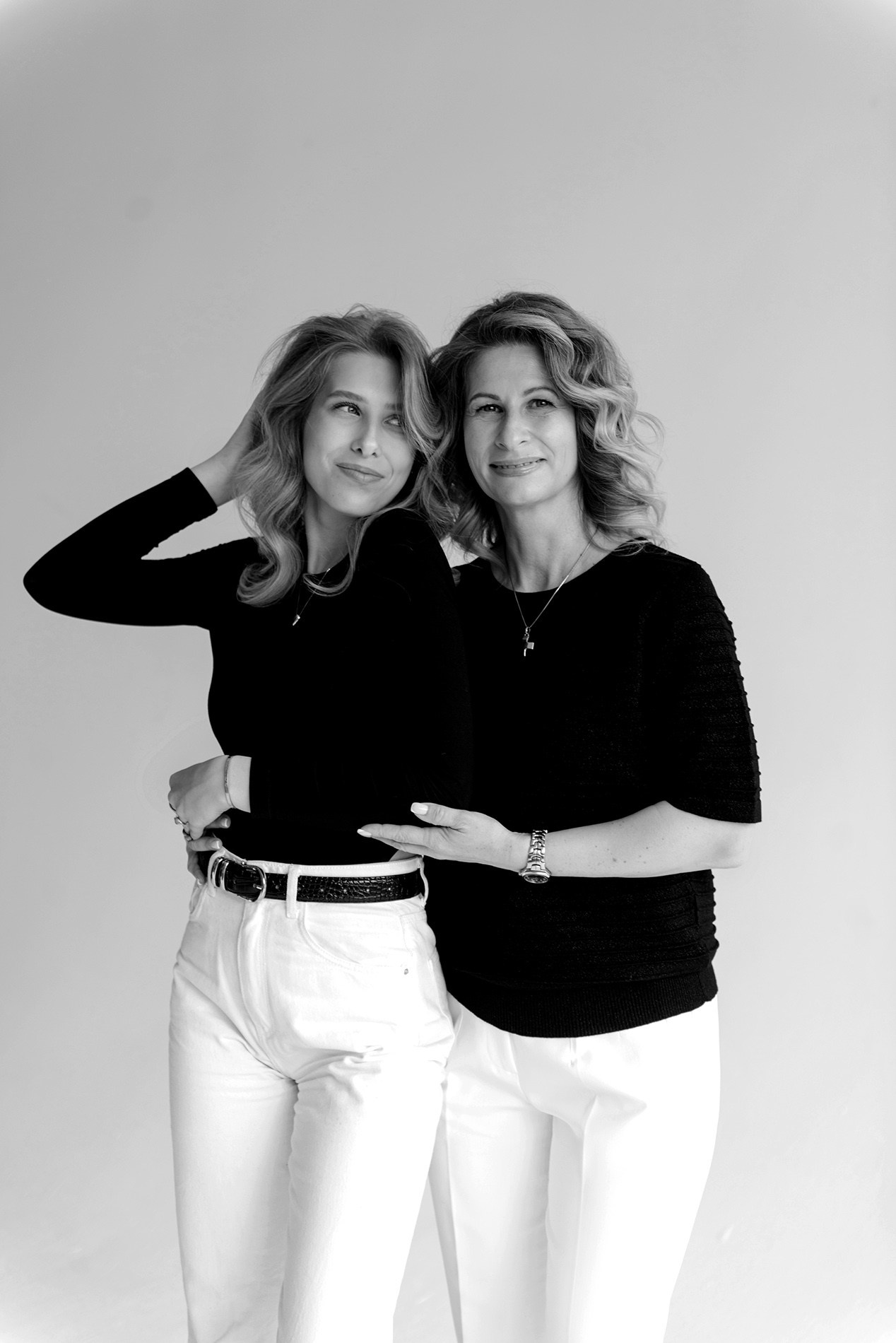 photo shoot for mom and daughter in the studio bw black and white
