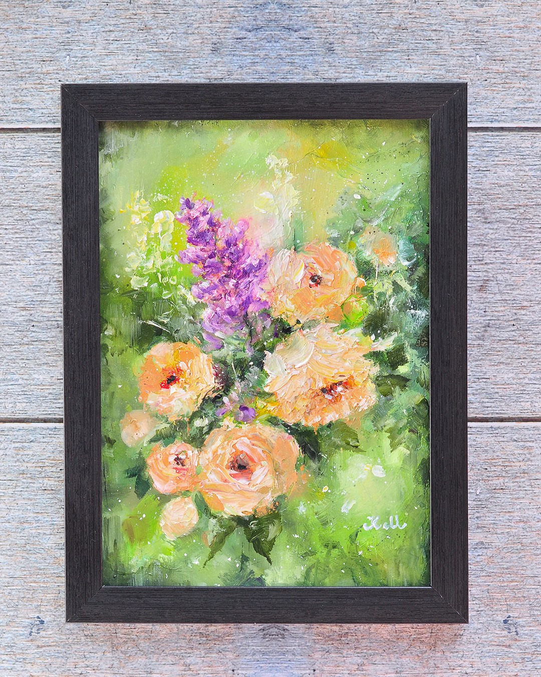Framed painting of lush flowers with peach roses and purple blooms set against a vibrant green background.