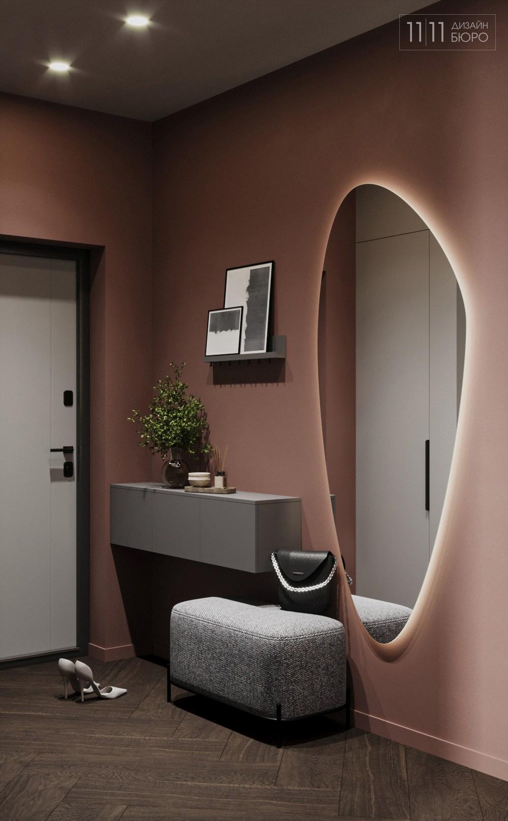 Прихожая с зеркалом неправильной формы и терракотовыми стенами