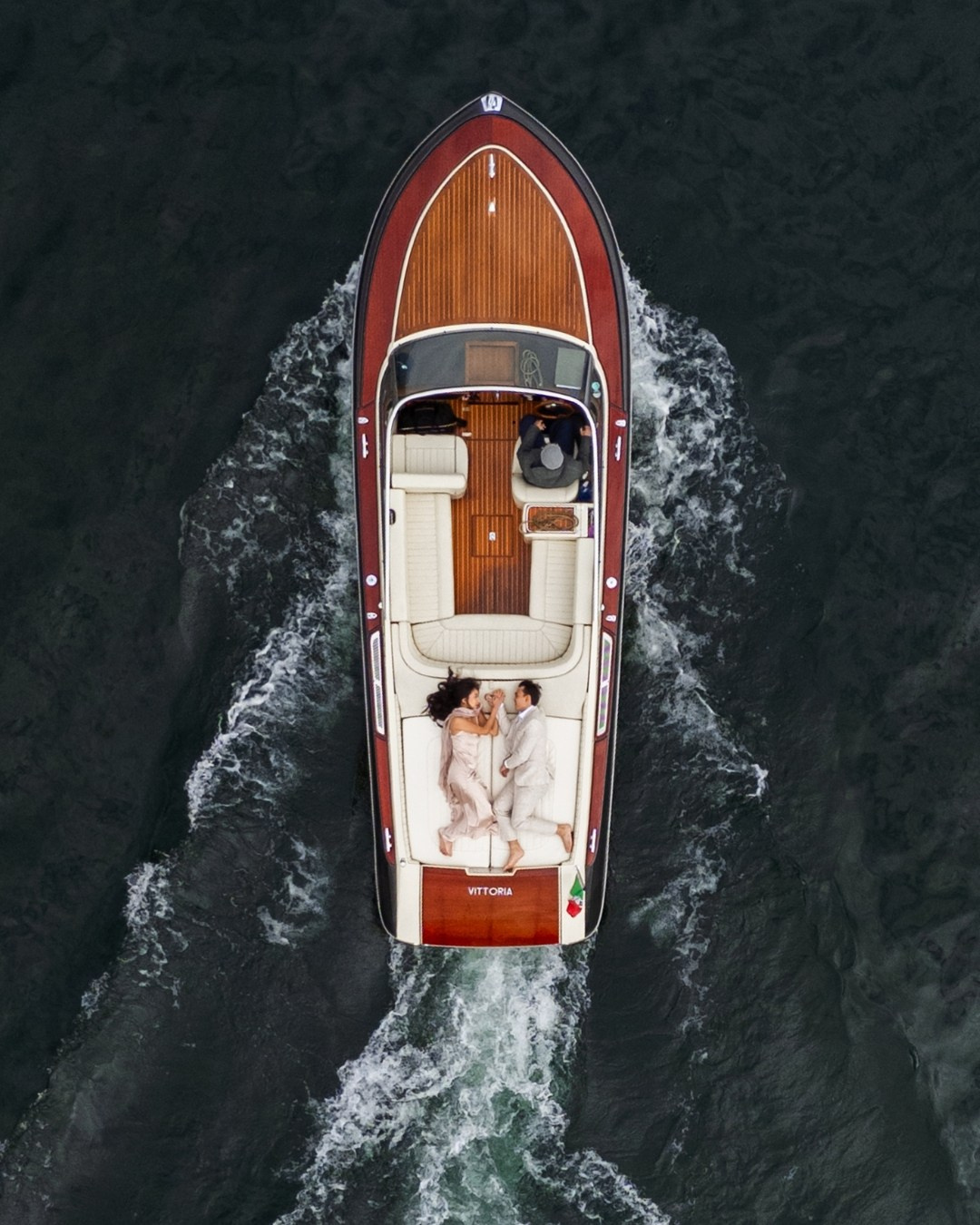 Drone photo of a boat on Lake Como for a proposal