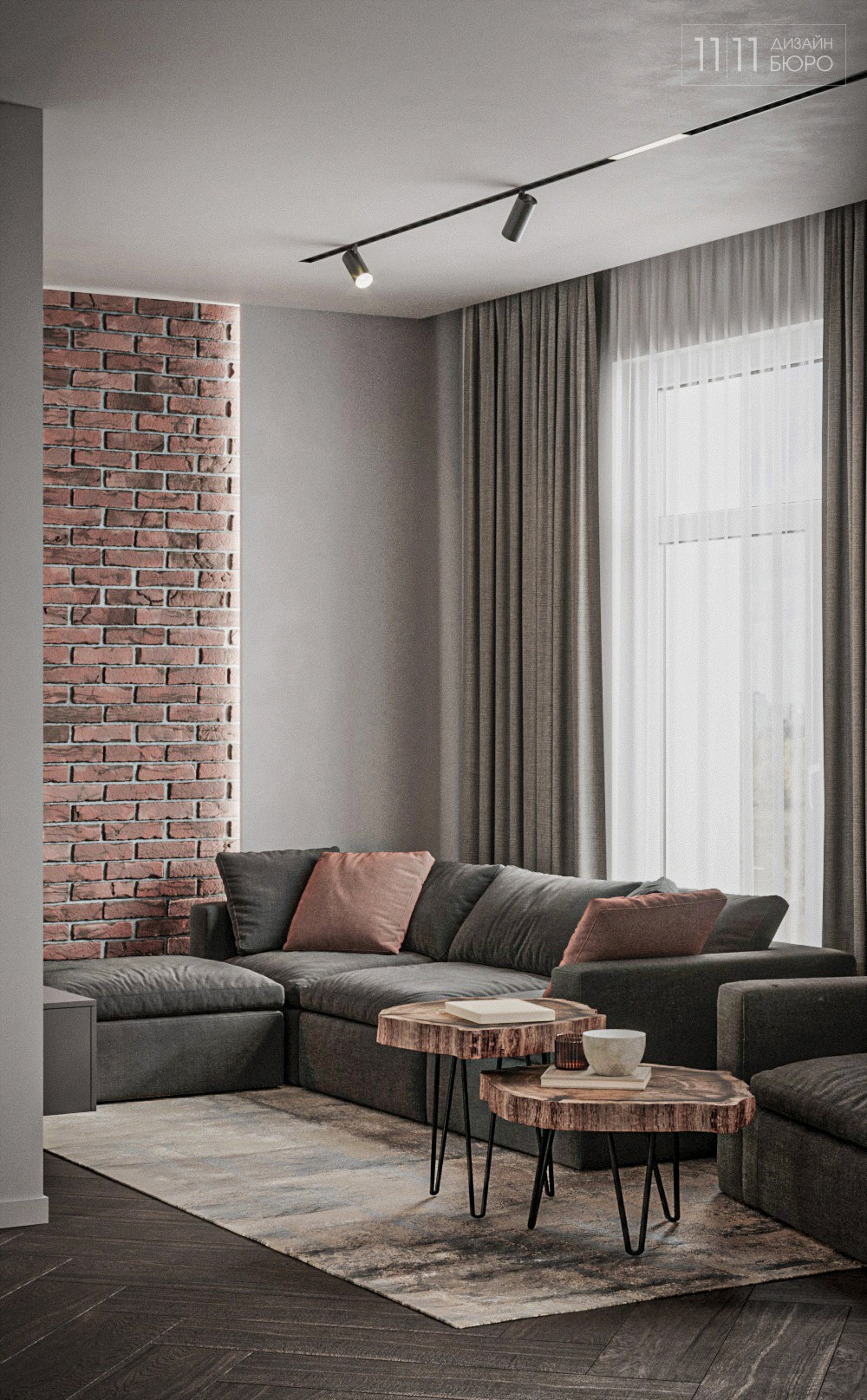 Интерьер гостиной с кирпичной стеной и трековыми светильниками