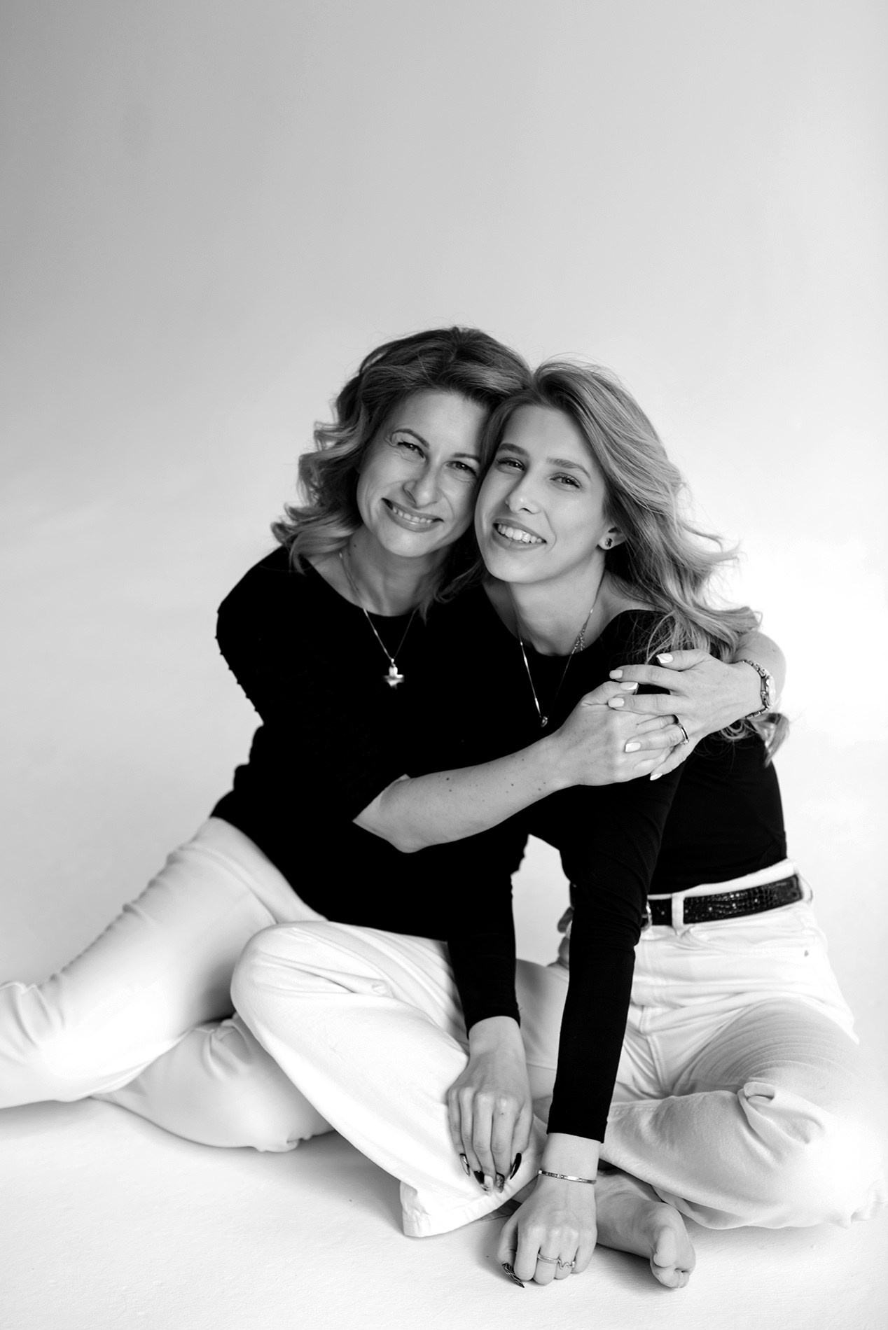 photo shoot for mom and daughter in the studio bw black and white