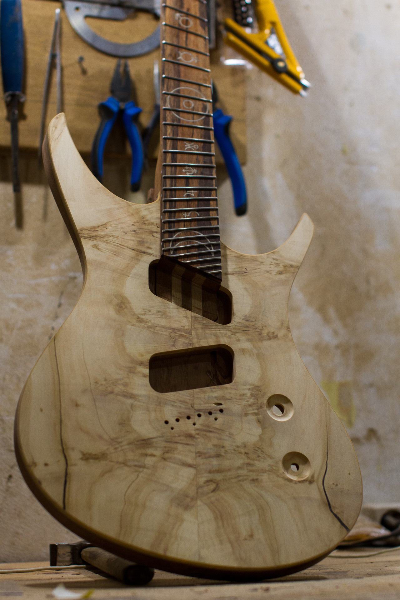 005. Master of making guitars and basses to order