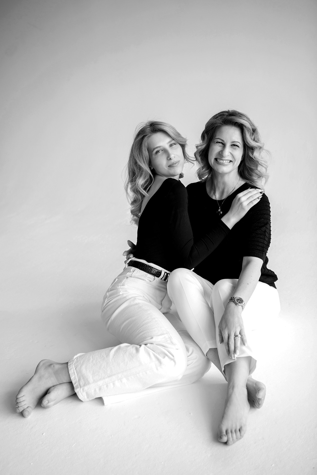 photo shoot for mom and daughter in the studio bw black and white
