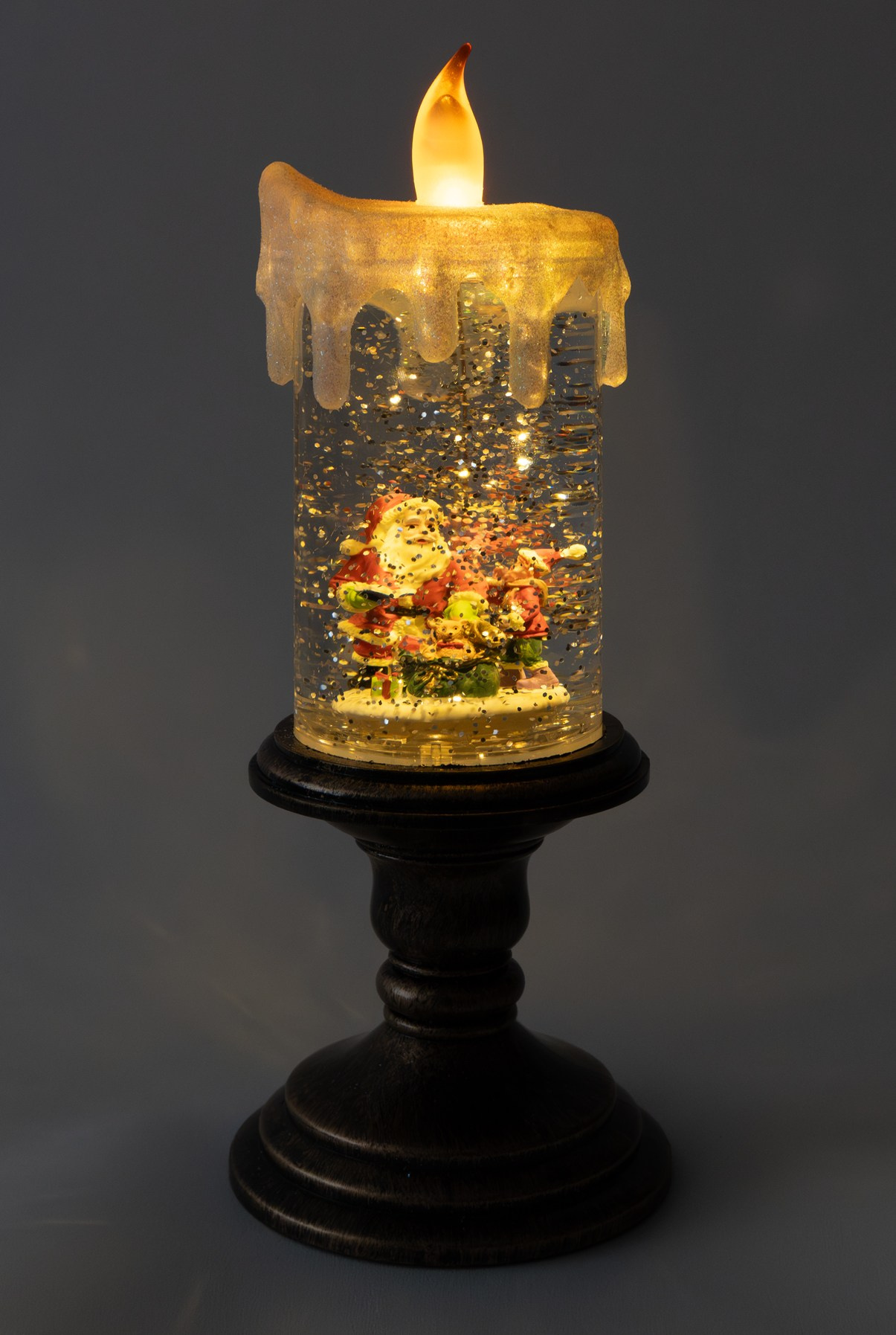 Свеча ночник с дедом морозом оранжевый свет включена на батарейках