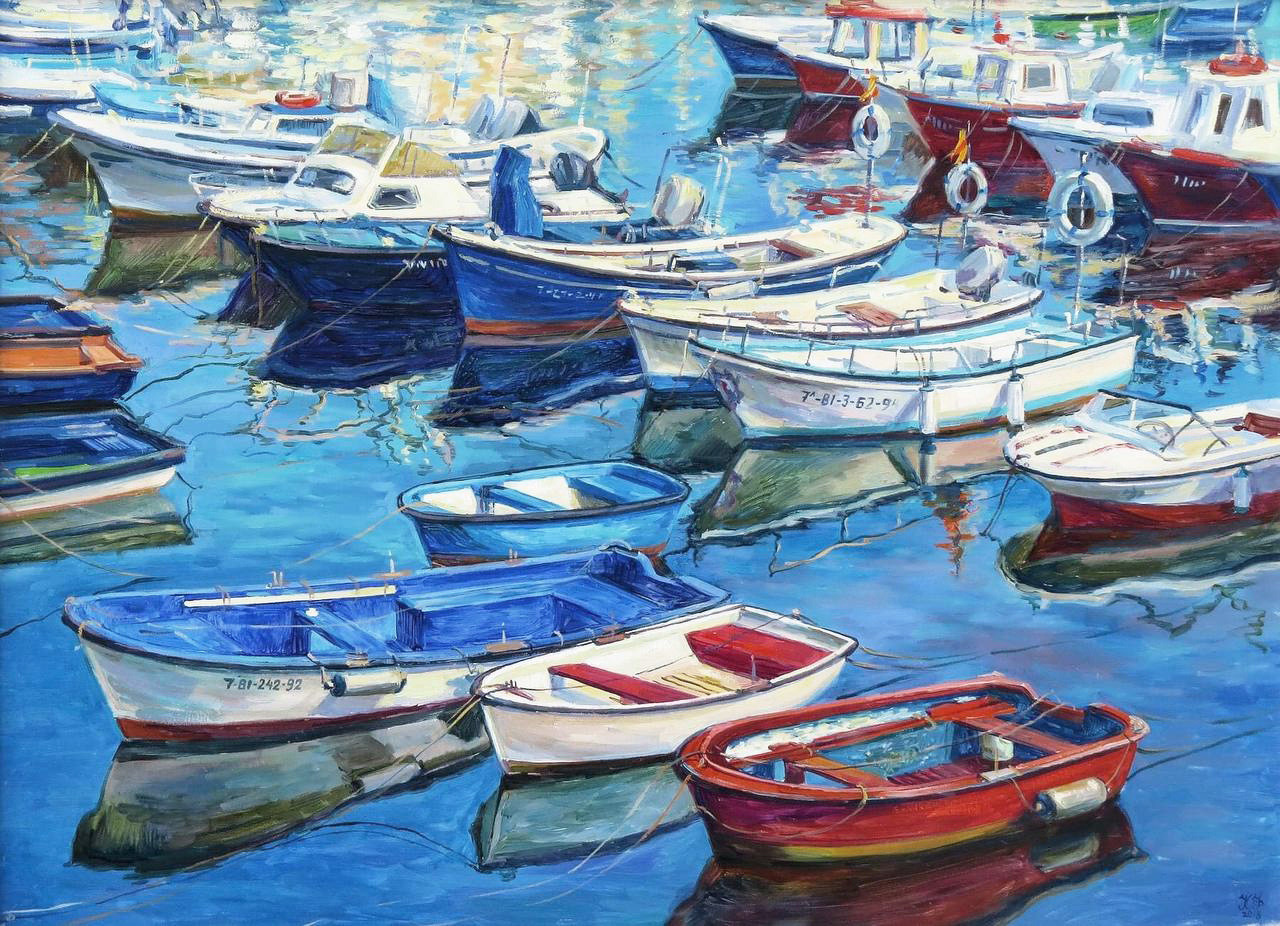 Three rows of red, white and navy blue boats