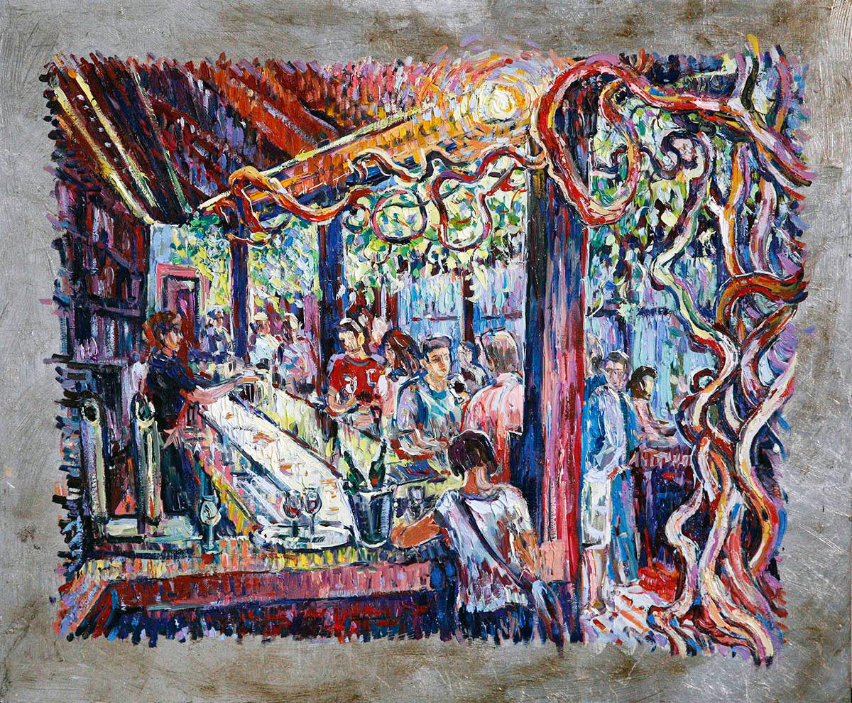 Interior of a bar with dense vegetation, lively conversation at the bar counter, and an illuminated countertop with pinchos.