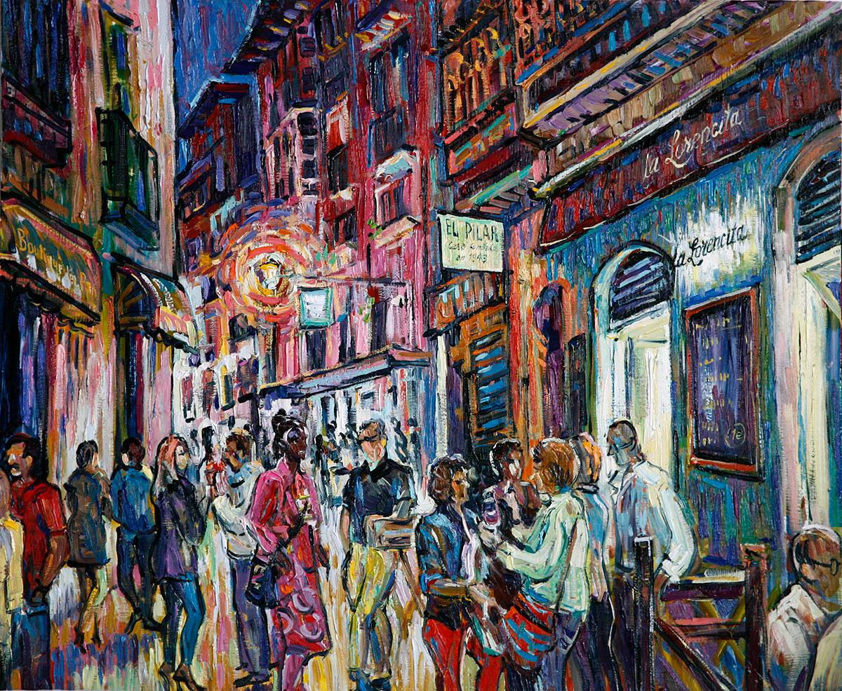 Friends with glasses in front of La Lorencita bar.