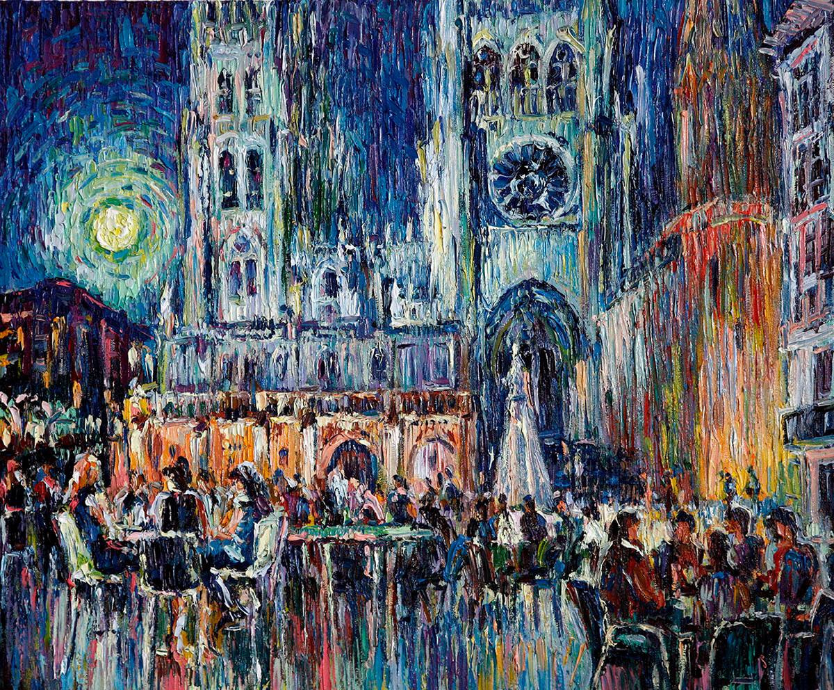 Night landscape with bars on the square in front of the cathedral in Burgos.