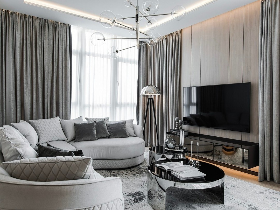 ТВ-зона с мягким диваном, стеклянным торшером и дизайнерским светильником | Валерия Котович