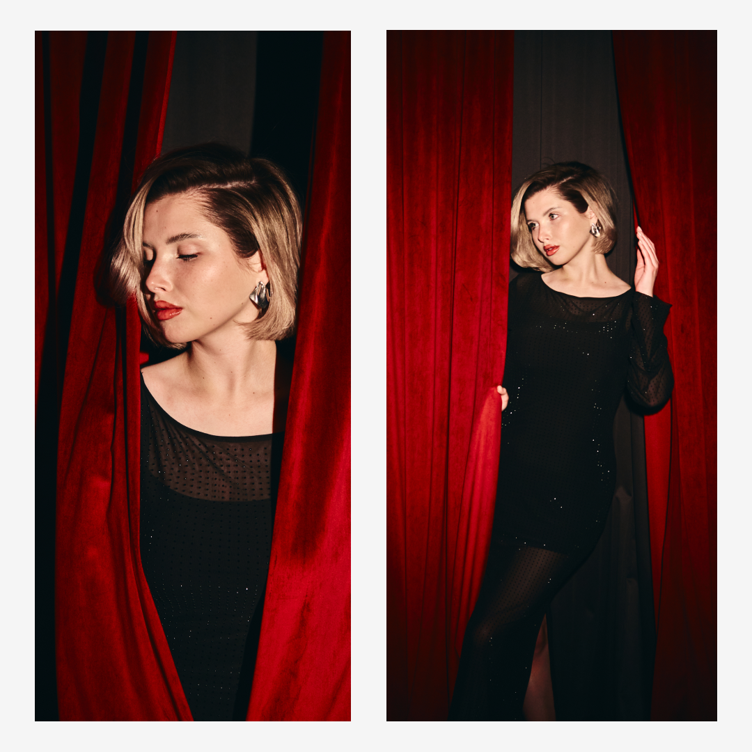 Портретная съёмка модели на фоне красного бархатного занавеса